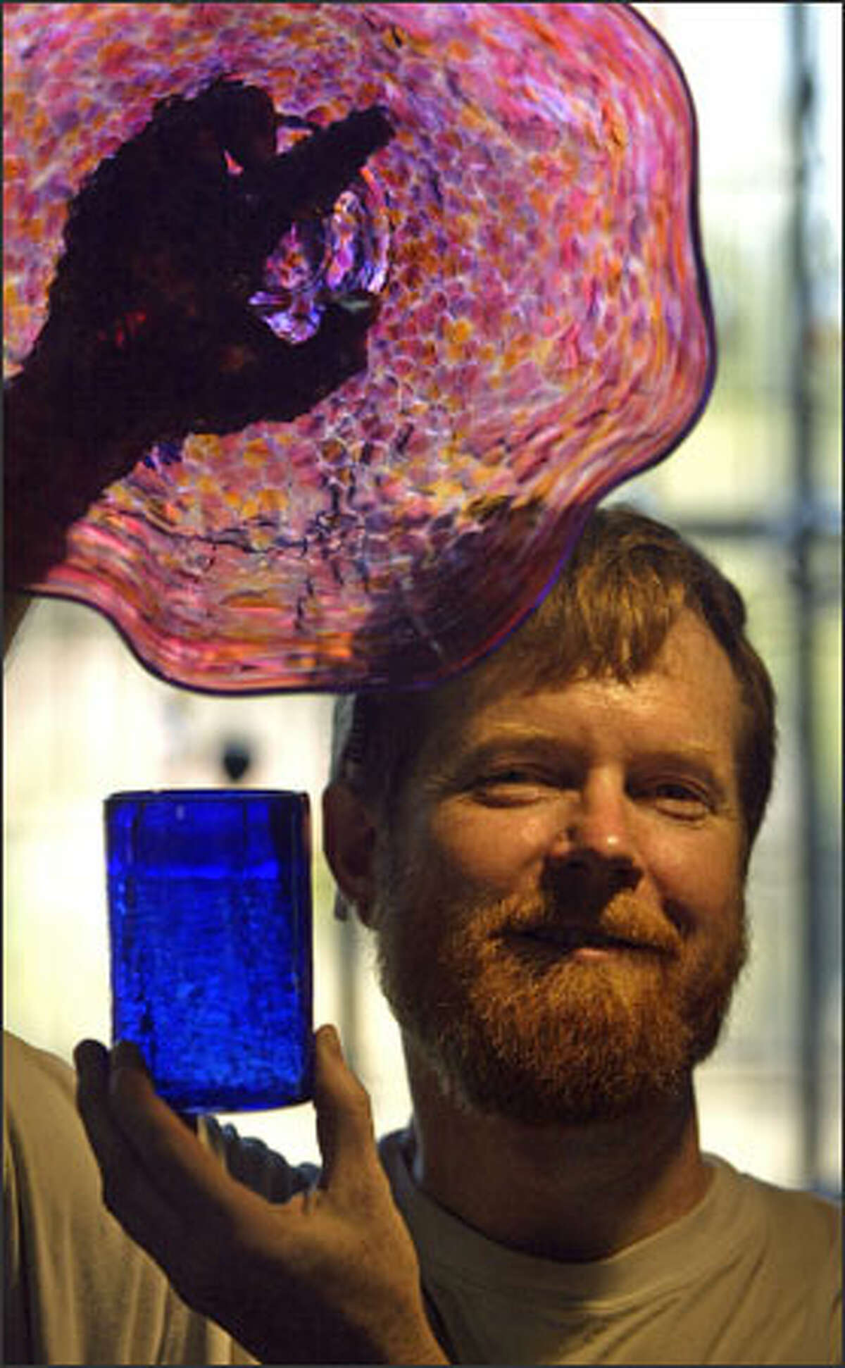 Glass blower David Smith at his studio in Ballard, Blowing Sands Glass Studio.