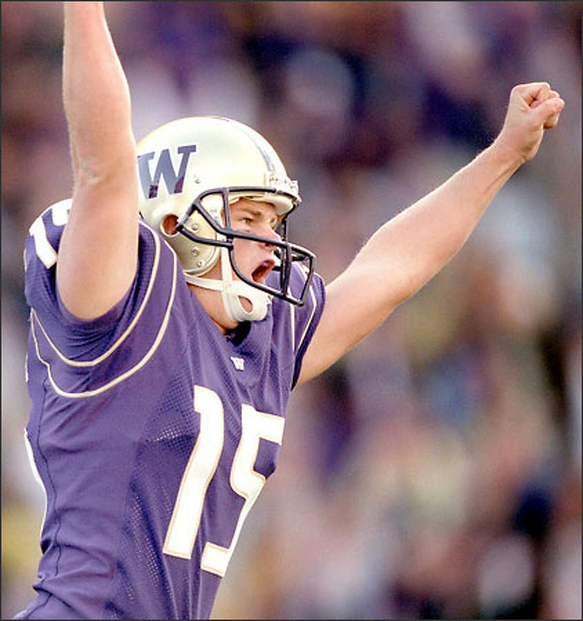 John Anderson celebrates after kicking the game-winning field goal with just 3 seconds left on the clock. The Huskies won 27-24.