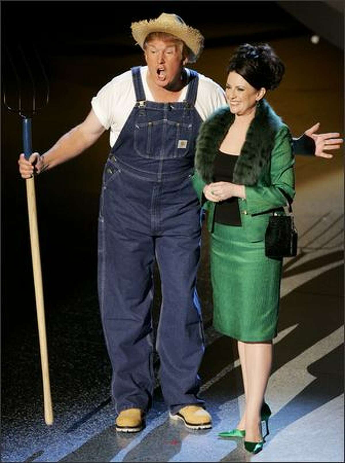 Donald Trump and Megan Mullally sing the theme from "Green Acres" in the opening round of a viewer's-choice "Emmy Idol" competition that ran throughout the 57th Annual Primetime Emmy Awards. No surprise: they won. (AP Photo/Mark J. Terrill)