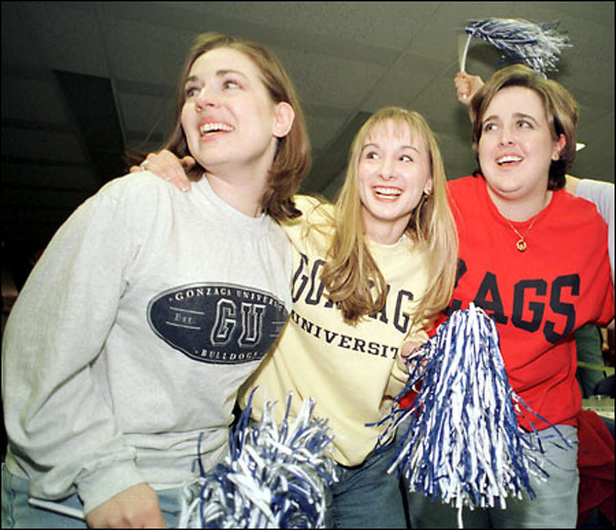 Gonzaga fans (from left) Heather Murray, Melissa Thompson and Tricia Burns watch the last seconds of their team's victory at the Crosby Center on the Gonzaga University campus in Spokane.
