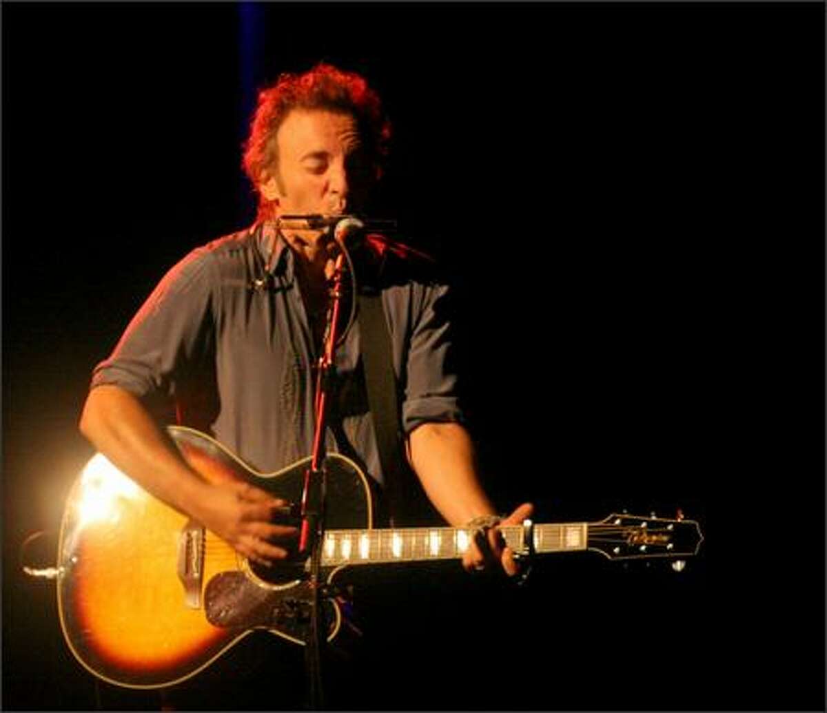 Bruce Springsteen performs the song "Devils & Dust" during his Devils & Dust concert at KeyArena Thursday night.