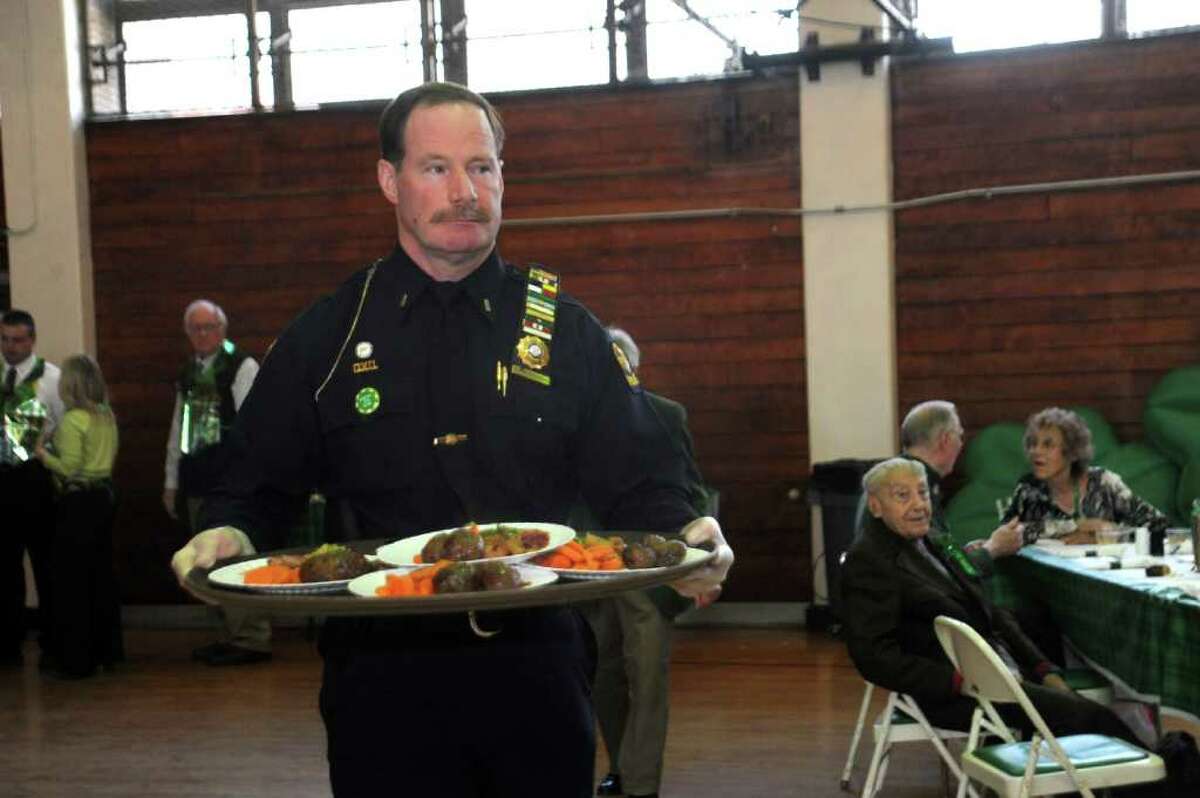 Greenwich Police Lt. Richard Cochran serves lunch at Greenwich Senior Center's St. Patrick's Party at the Eastern Greenwich Civic Center, on Thursday, March 17, 2011.