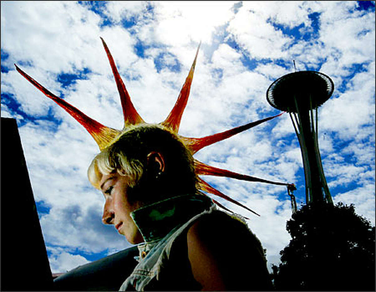 Comice Johnson, 17, came from Eugene, Ore., to listen to the many bands performing at the Bumbershoot arts festival at the Seattle Center.Eklund: Bumbershoot is one of the best festivals in Seattle. You get a great mix of characters. I had a strobe on a cord and I had one of her friends hold my light, while I took a few shots of her after a concert.