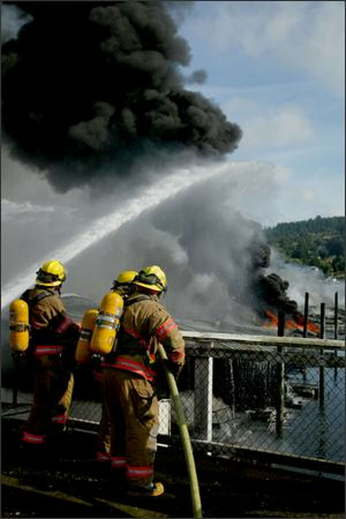 Firefighters fight a fast-moving fire at the Harborview Marina in downtown Gig Harbor.