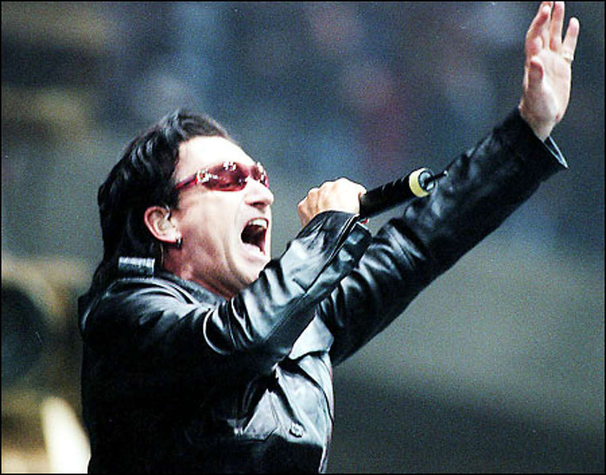 U2's frontman Bono belts out "Elevation," the signature song of their Elevation tour at the tour's stop at the Tacoma Dome.