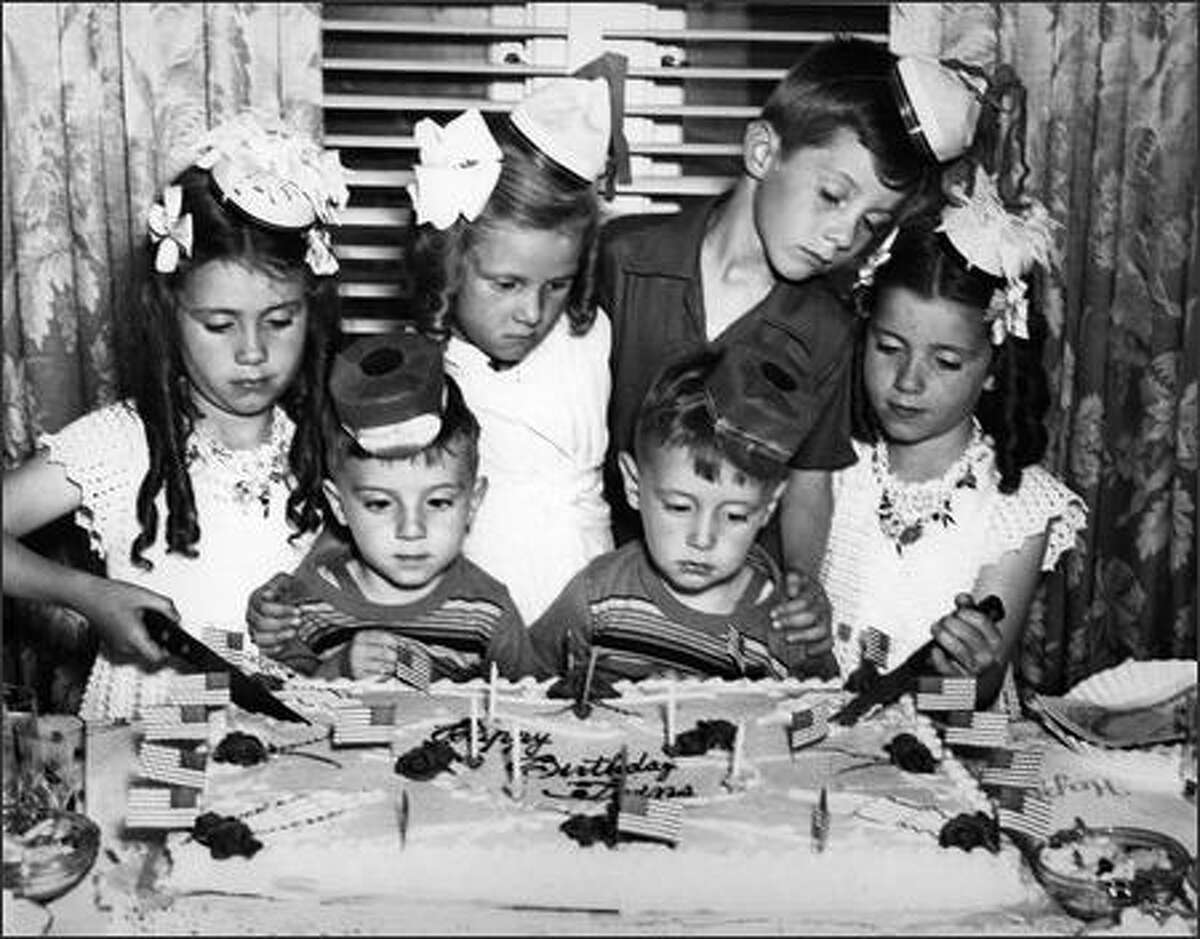 Phil Webber wondered if his career choice might have been inspired at an early age when a P-I photographer snapped this photo of a joint birthday party for three sets of twins. In front are Phil, on the right, and his twin brother, Bill; they were 3.