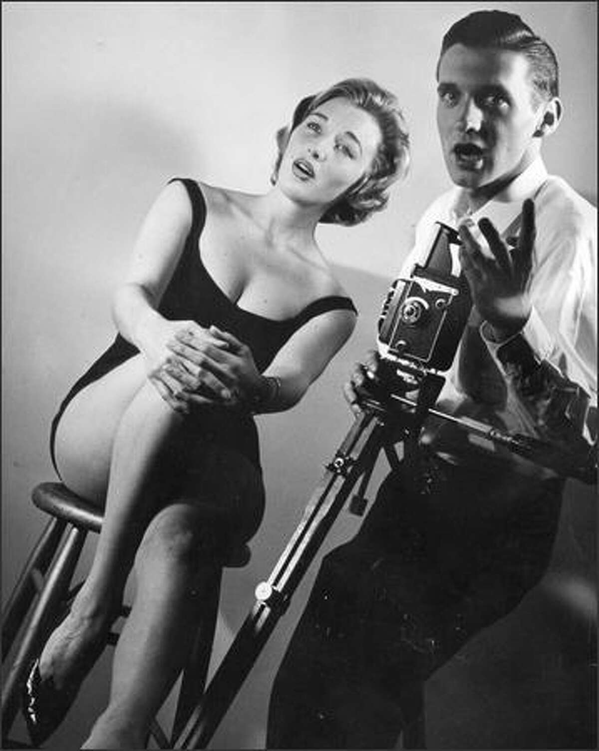 Model Lynn Maidment struck a "cheesecake" pose for Phil Webber in July 1959. Webber said that he liked the small, twin-lens reflex camera -- a light, fast-operating, versatile machine becoming popular among newsmen in this area.Tom Brownell / Seattle Post-Intelligencer
