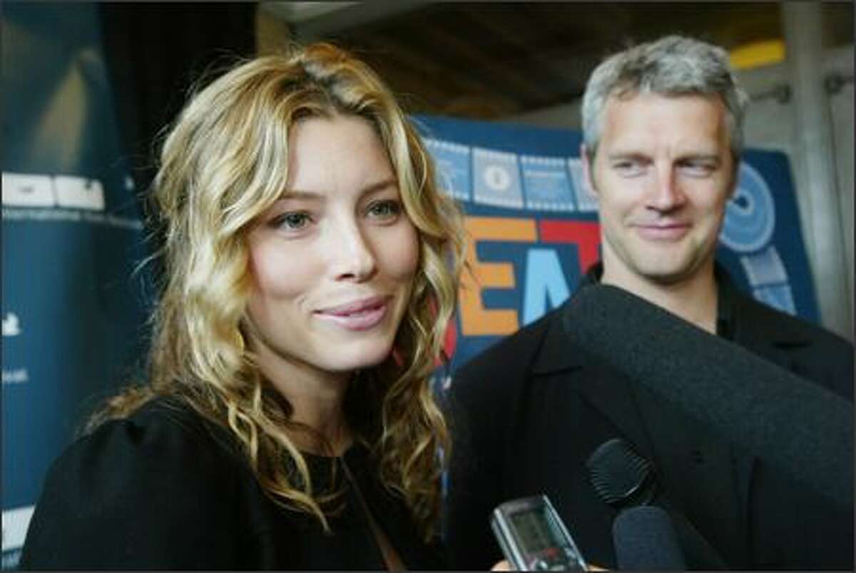 Actress Jessica Biel and director Neil Burger answer questions from the media on the red carpet at the Seattle International Film Festival's opening night premiere of their film "The Illusionist" at the Paramount Theater.