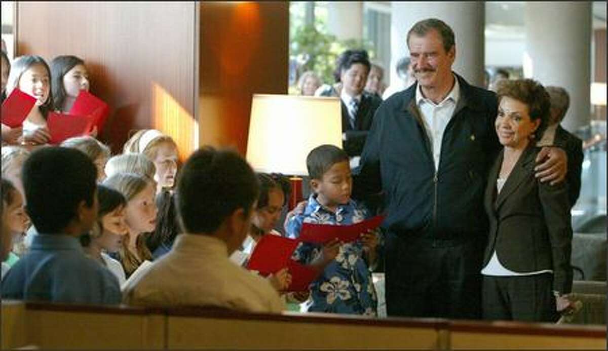 Students from the John Stanford International School serenade Mexican President Vicente Fox and his wife, Martha Sahagun, at Seattle's Westin Hotel.