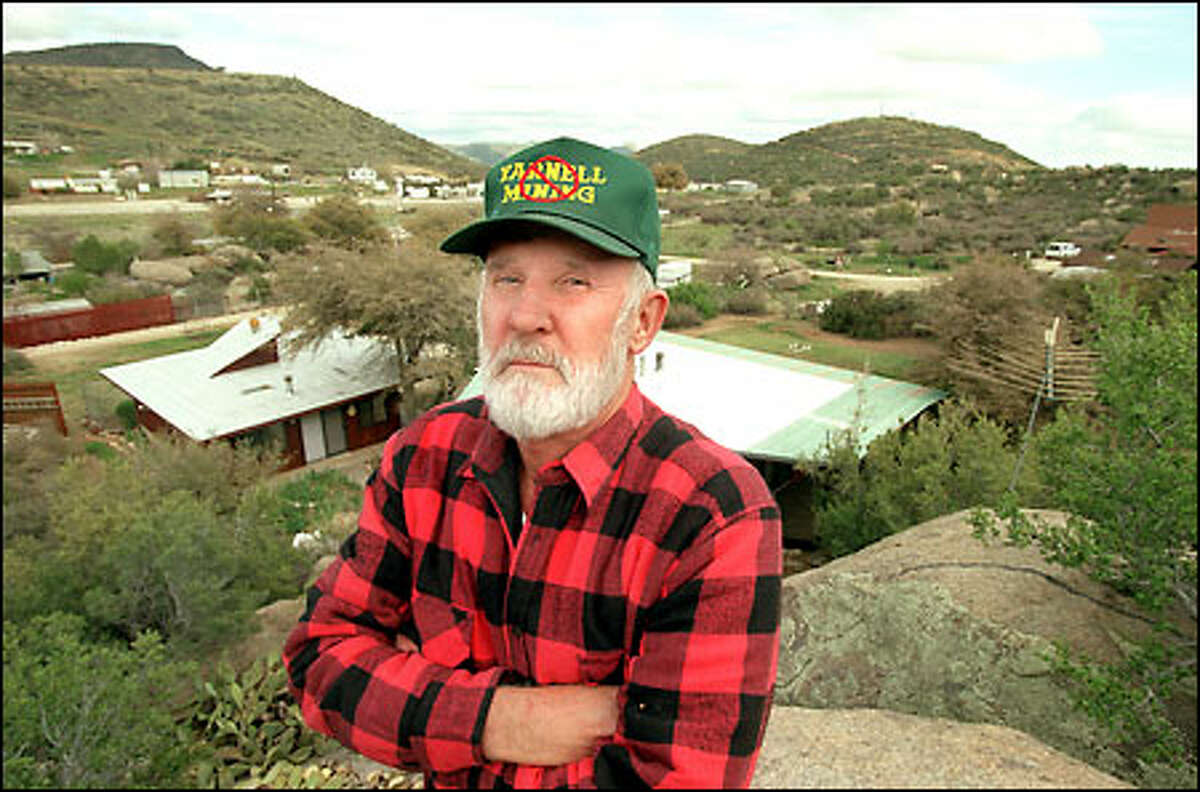 ARIZONA IN THE BLAST ZONE, Bill Ashworth, one of the many retirees living in Yarnell, Ariz., says that if Bema Gold Inc. is allowed to begin mining a site on Weaver Mountain behind him, residents will be forced to evacuate.
