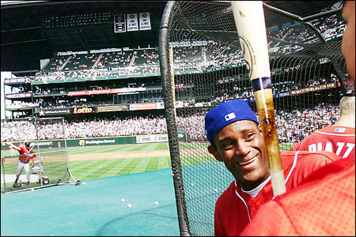 Sammy Sosa chats with friends during batting practice at Safeco Field prior to the start of the All Star Game.