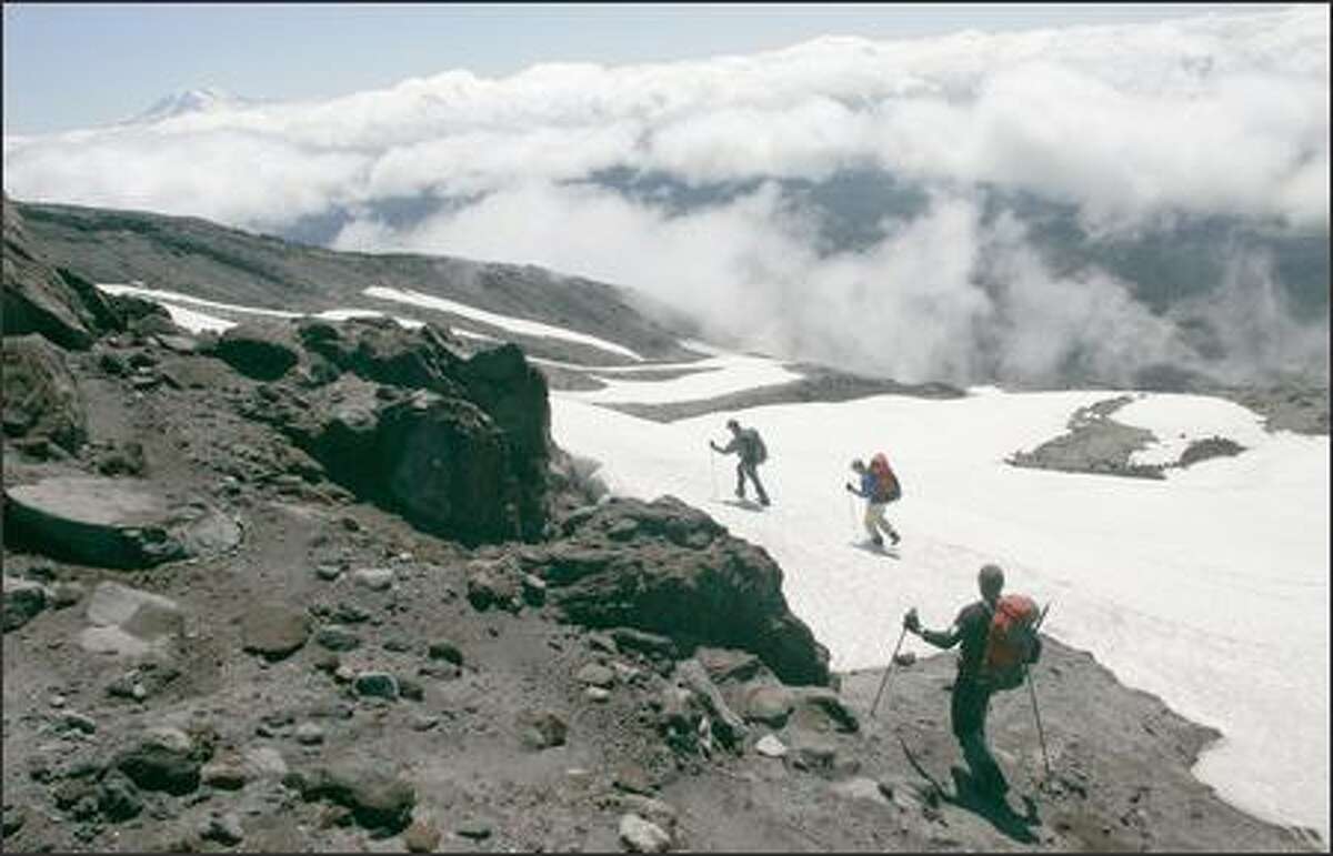Media representatives join U.S. Forest Service Climbing Rangers on a hike to the rim of Mount St. Helens on Thursday. The climb will soon be open to the public after having been closed since 2004 due to volcanic activity.