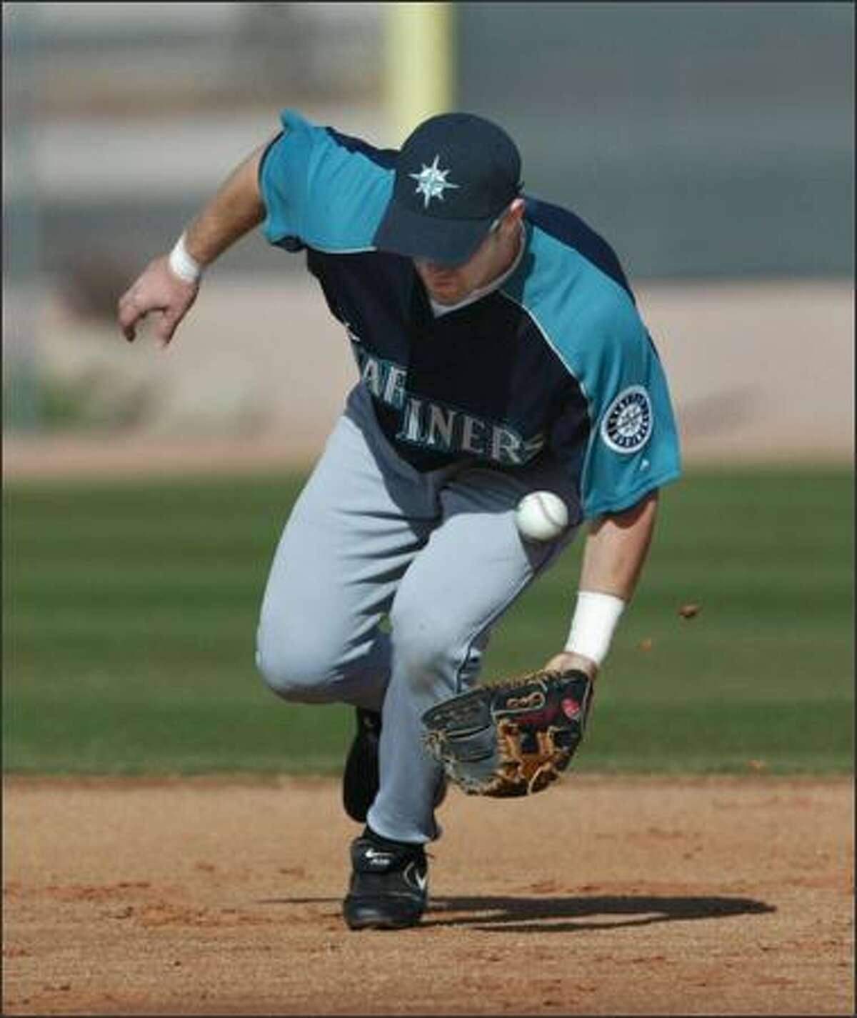 A hard infield caused some interesting hops as Willie Bloomquist found out while taking ground balls at shortstop.