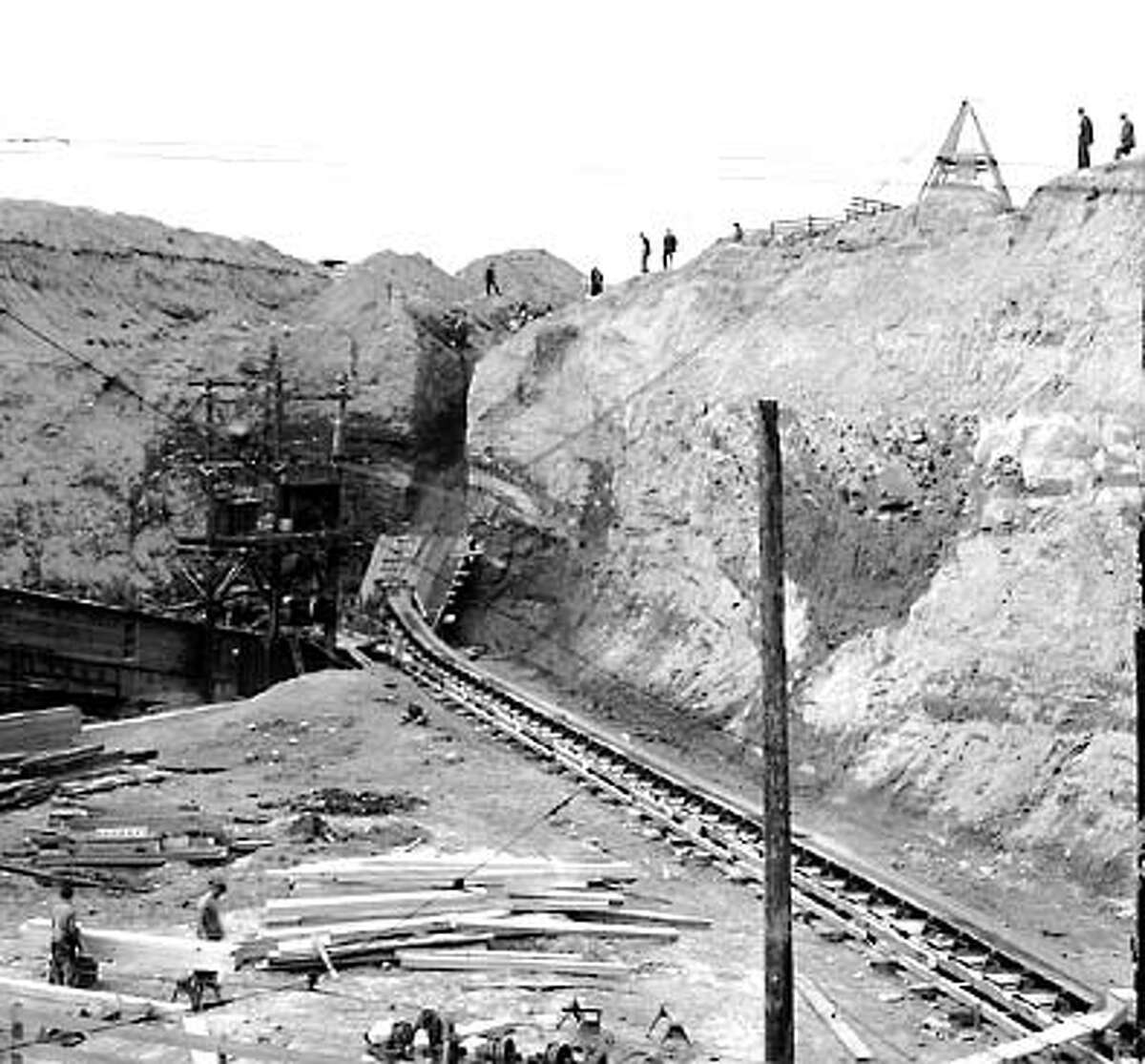 At the time, the Seattle Post-Intelligencer referred to the regrade as "one of the great engineering projects of the West." Steam shovels and water sluices ate away at the hillside and conveyor belts carried the dirt to the waterfront for disposal.