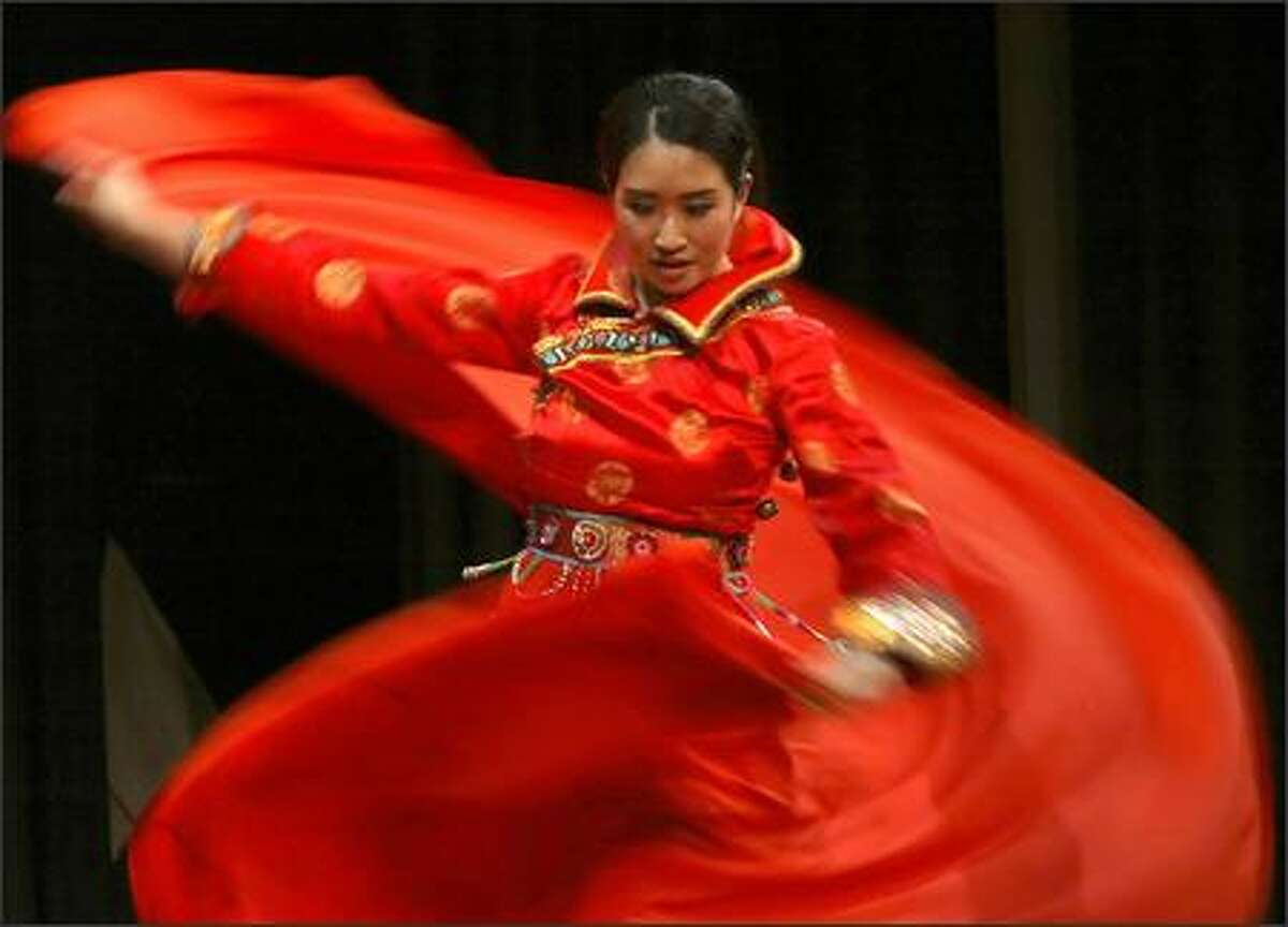 Tiffany Wan is a blur of motion as she performs a traditional Mongolian dance during the creative expression presentations at the 2006 Miss Seafair coronation Tuesday in Seattle.