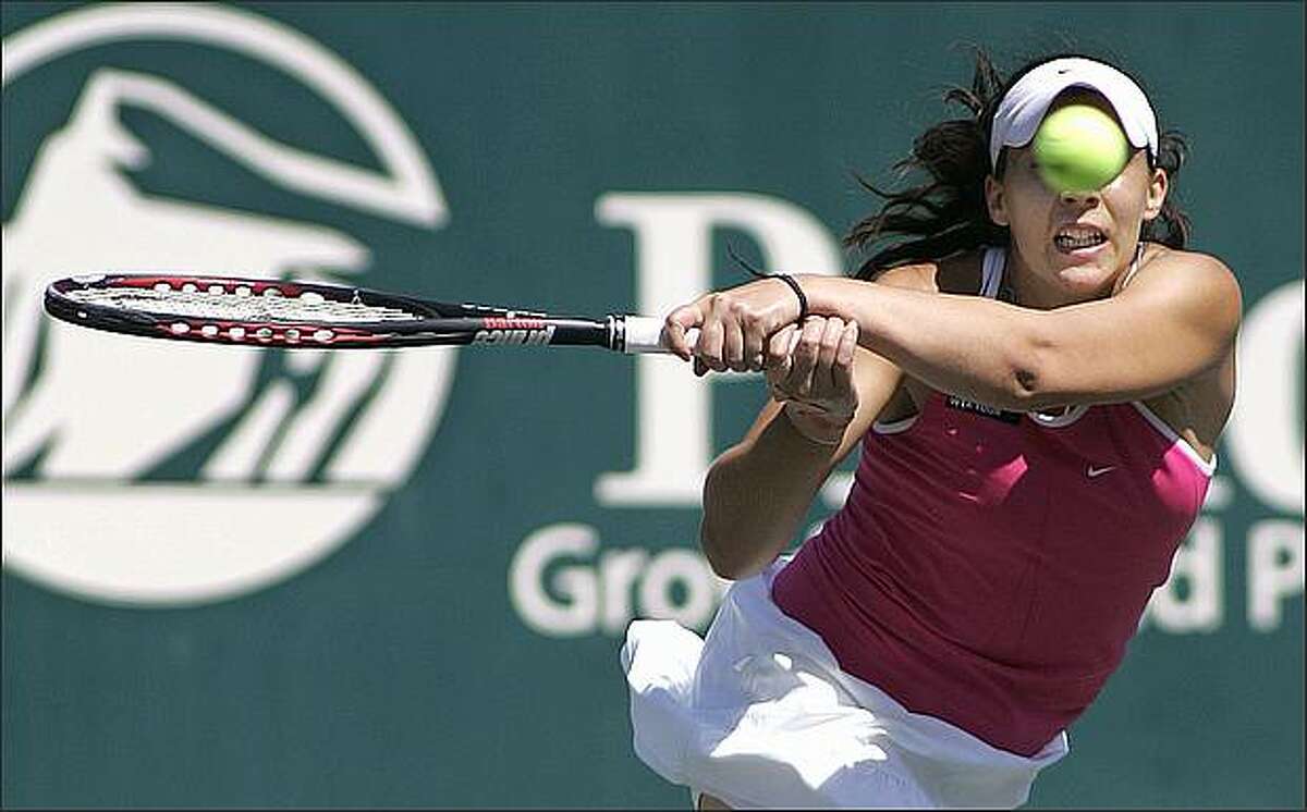 Marion Bartoli of France returns a volley during her women's tennis match against Melanie Oudin of the U.S. at the Family Cup Circle Tennis Tournament in Charleston, S.C., on April 16.