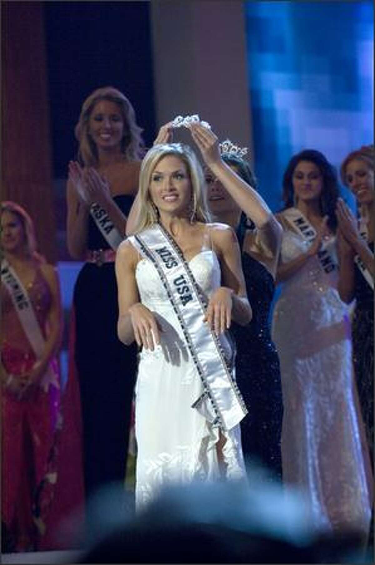 Tara Conner reacts after being crowned Miss USA.