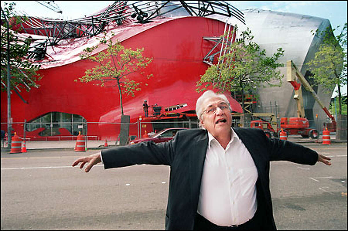A MONUMENT TO ROCK'N ROLL, 2000: Iconoclastic architect Frank Gehry cavorts in front of the Experience Music Project, the music museum he designed at the Seattle Center, financed by Paul Allen. The museum is an example of the impact the city's high-tech entrepeneurs are making.