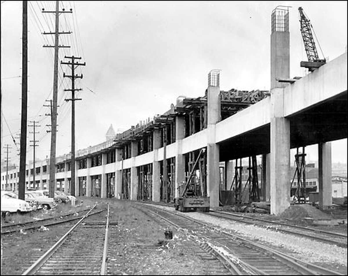 Extension of the Alaskan Way Viaduct, 1957: Initially terminating at the south end of Pioneer Square in 1953, the Alaskan Way "Sea Wall" -- as it was called by some opponents -- is 60 percent complete in this photo.
