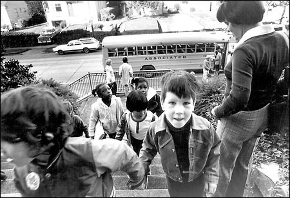 School desegregation begins, 1978: Students arrive at Magnolia Elementary School after a bus ride from Dearborn Park Elementary as the school desegregation program in Seattle got under way in September 1978.