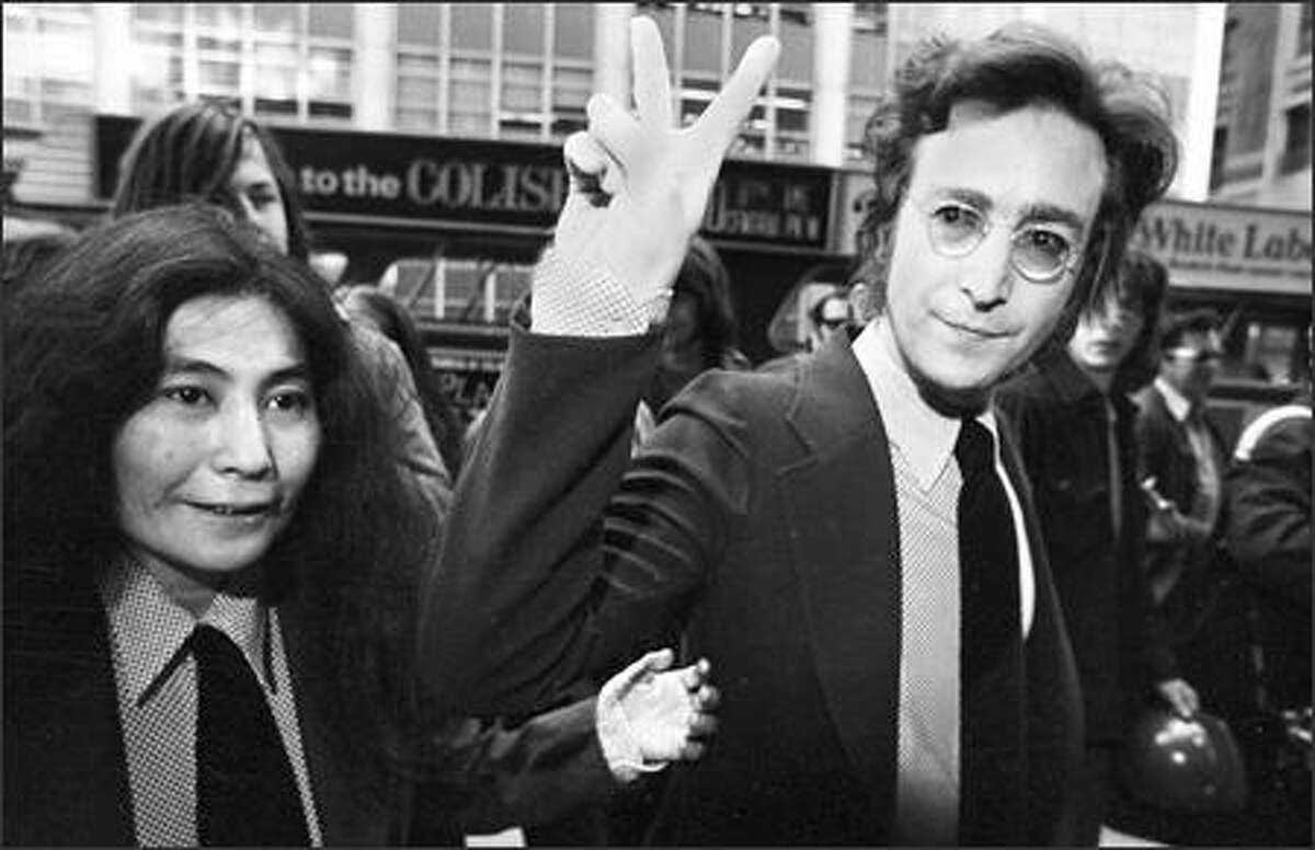 Former Beatle John Lennon, giving the peace sign, and his wife, Yoko Ono, arrive for a hearing on their deportation case at U.S. Immigration and Naturalization Service office in lower Manhattan, on May 12, 1972. The ex-Beatle's celebrated battle with the feds is chronicled in "The U.S. vs. John Lennon," a documentary tracing how he went from rock star to fierce anti-war protester to "undesirable alien." The documentary playedat the Toronto Film Festival in advance of its theatrical debut Friday.