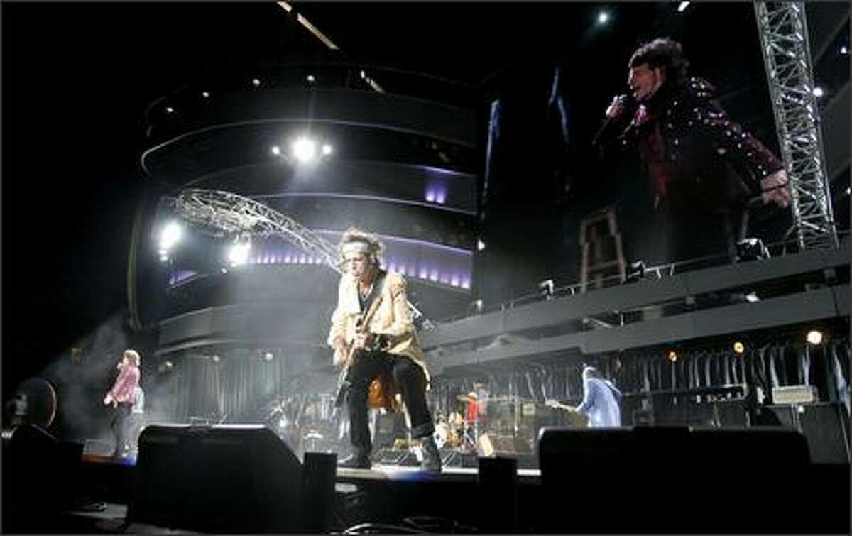 Rolling Stones guitarist Keith Richards preens for the fans. Richards turns 63 on Dec. 18.