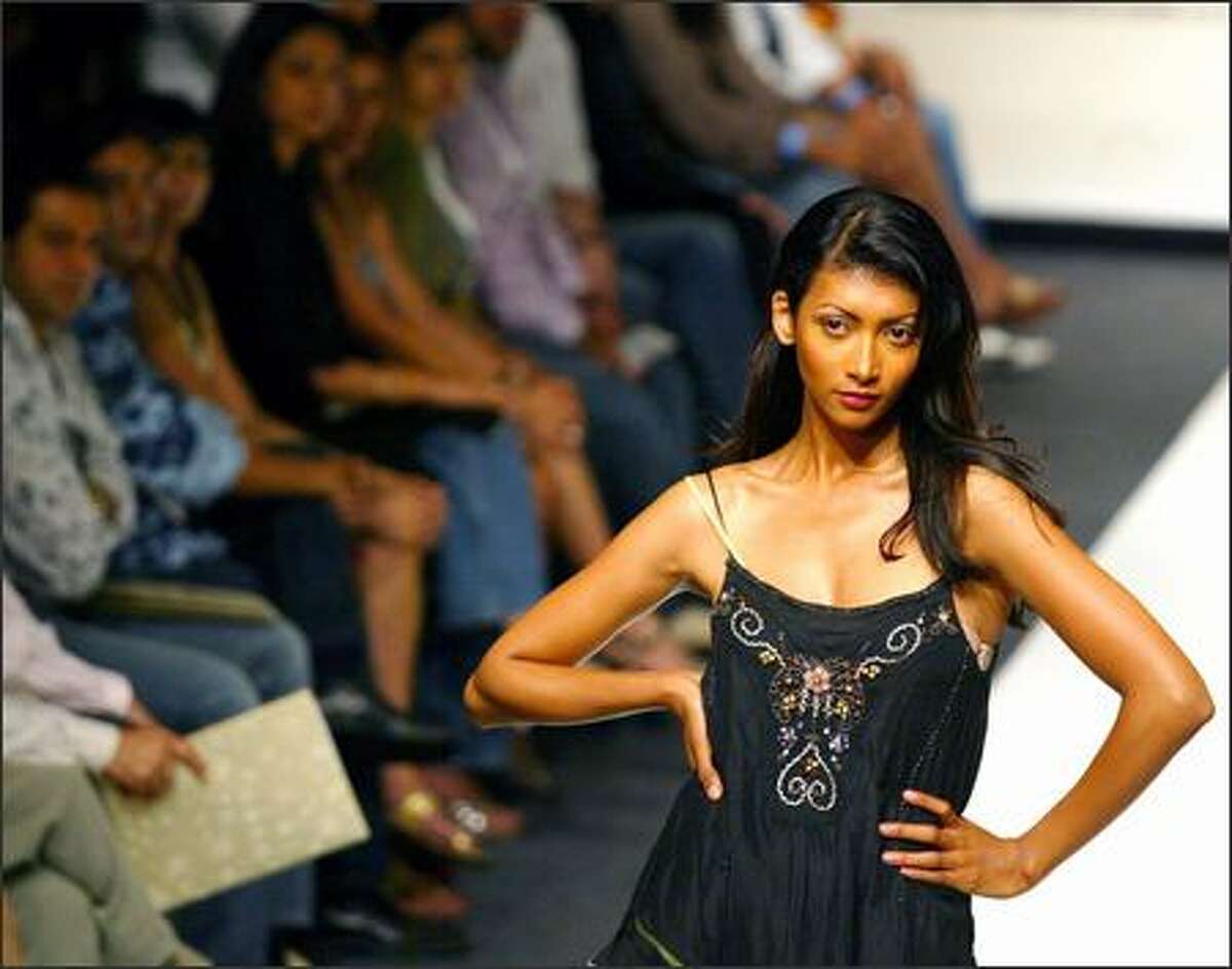A model presents a creation of designer Vineet Bahi at the Lakme Fashion Week in Mumbai, India, Tuesday. (AP Photo/Rajesh Nirgude)