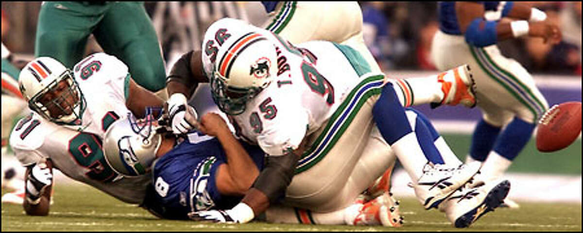 With 9:46 left in the fourth quarter Seahawks Matt Hasselbeck is sacked for a loss of 11 as Dolphins' Tim Bowens forces the fumble which was recovered by the Seahawks.