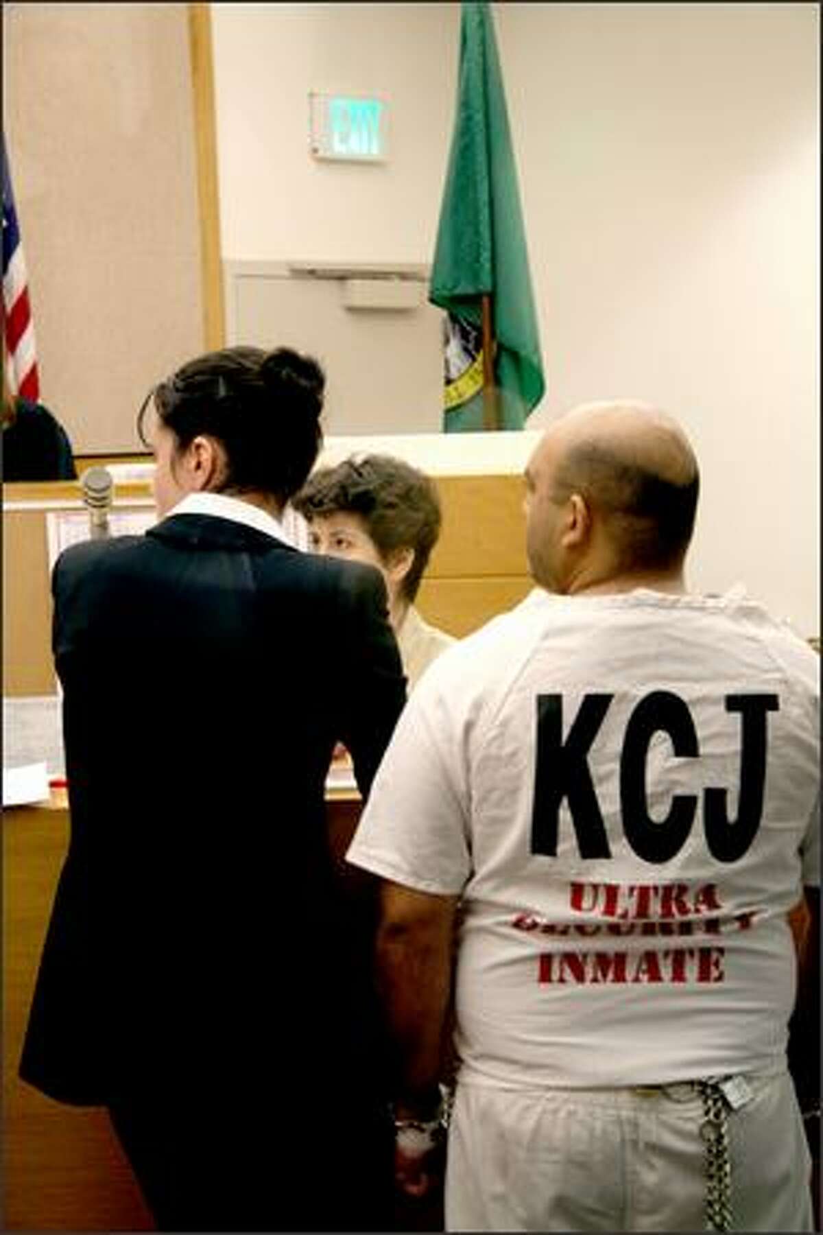 Naveed Afzal Haq, 30, is brought into the courtroom after being booked into the King County Jail.