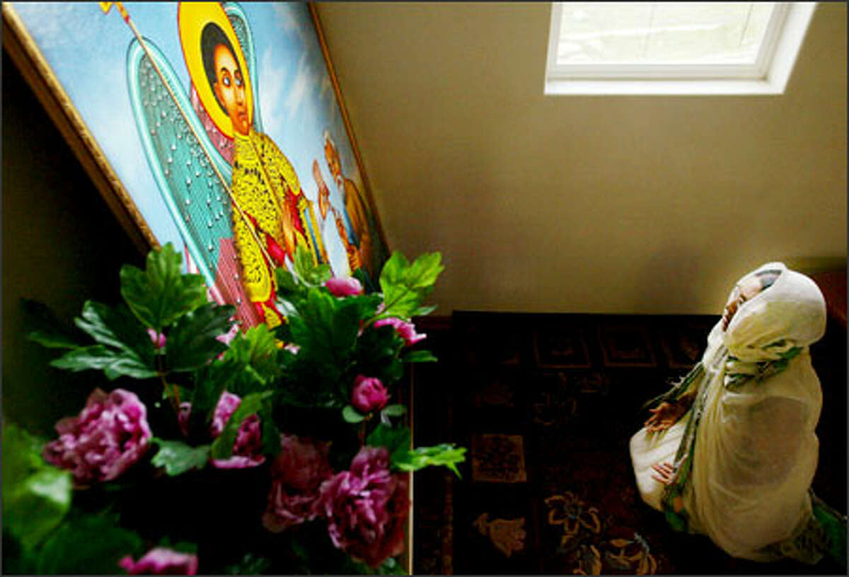 Belainesh Zelelew prays and weeps at Saint Gebriel Church of Ethiopians for her son, Daniel Ambaw, who faces a prison sentence for a drug offense.Brown: There were only four people in the church that chilly morning: myself and a reporter, and a mother and father, immigrants from Ethiopia who had just found out that their son would be spending a long time in jail on drug charges. The mother prayed silently ... a view of the depth of pain immigrant parents must experience as they watch their children swept up into an alien culture.