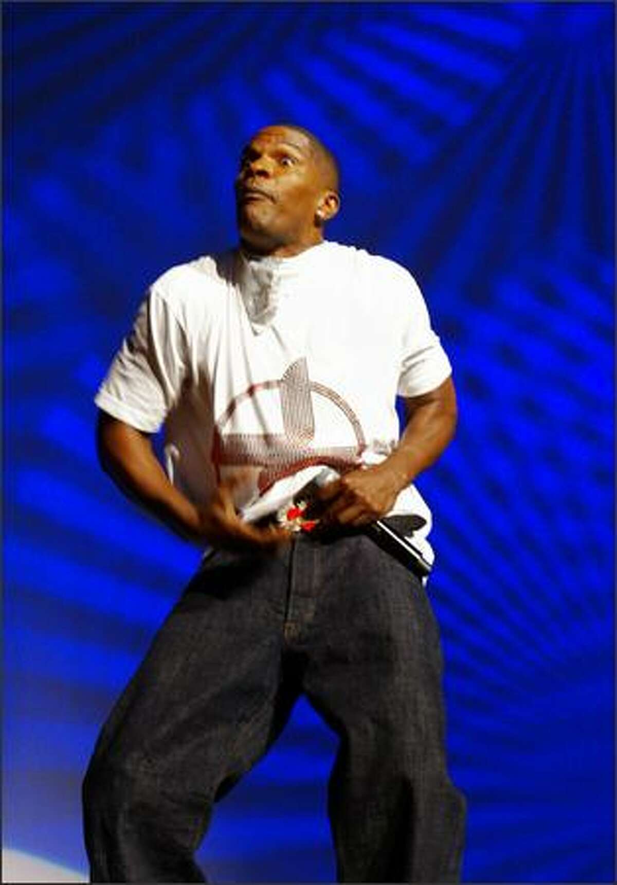 Jamie Foxx pretends he is going to take off his pants during the comedy portion of his show at KeyArena Friday.