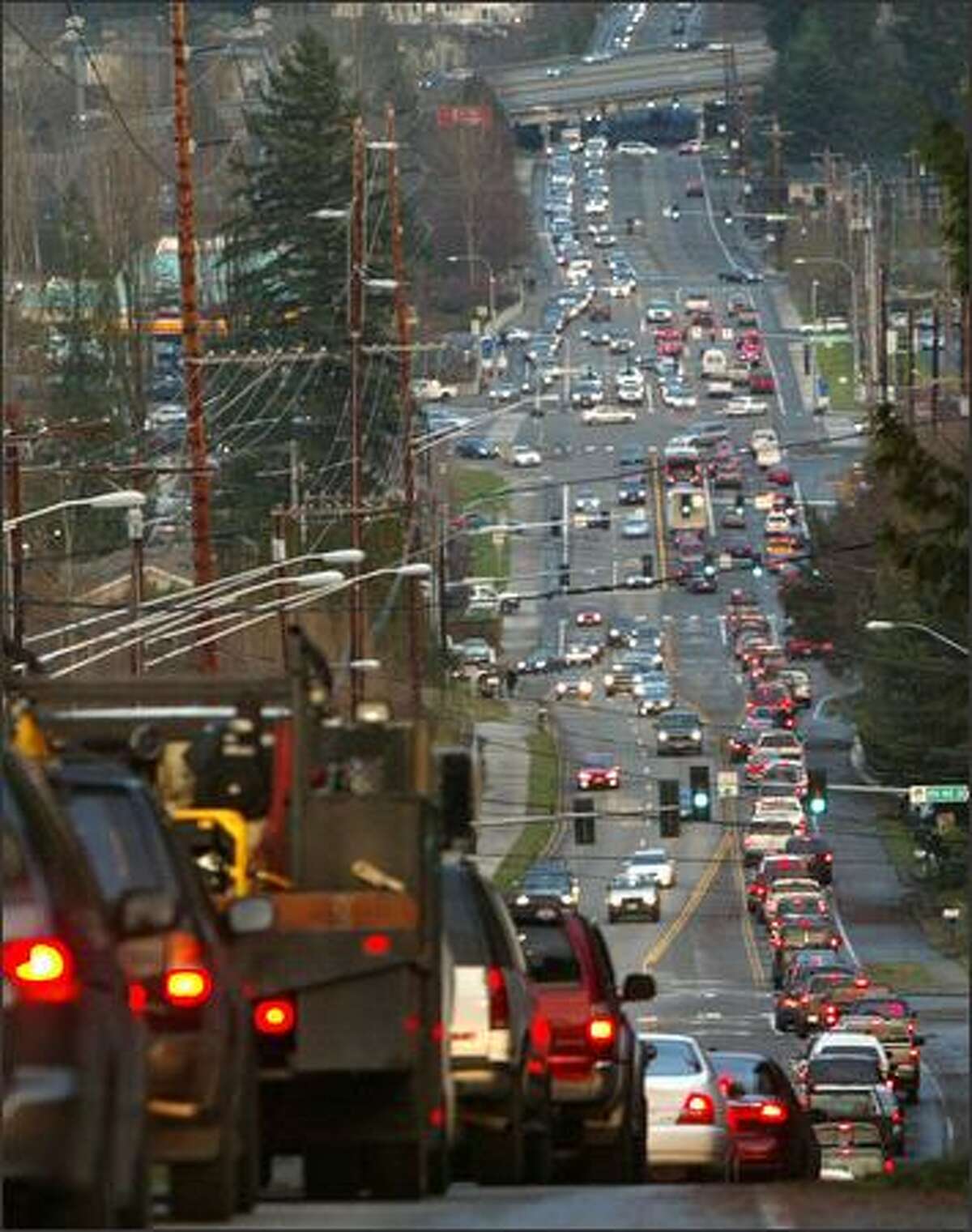 Traffic back up on roads in South Snohomish County Friday after winds downed trees and power lines throughout much of the area. Drivers trying to get around major backups clogged even minor streets and backgrounds. Seattle Post-Intelligencer / Grant M. Haller