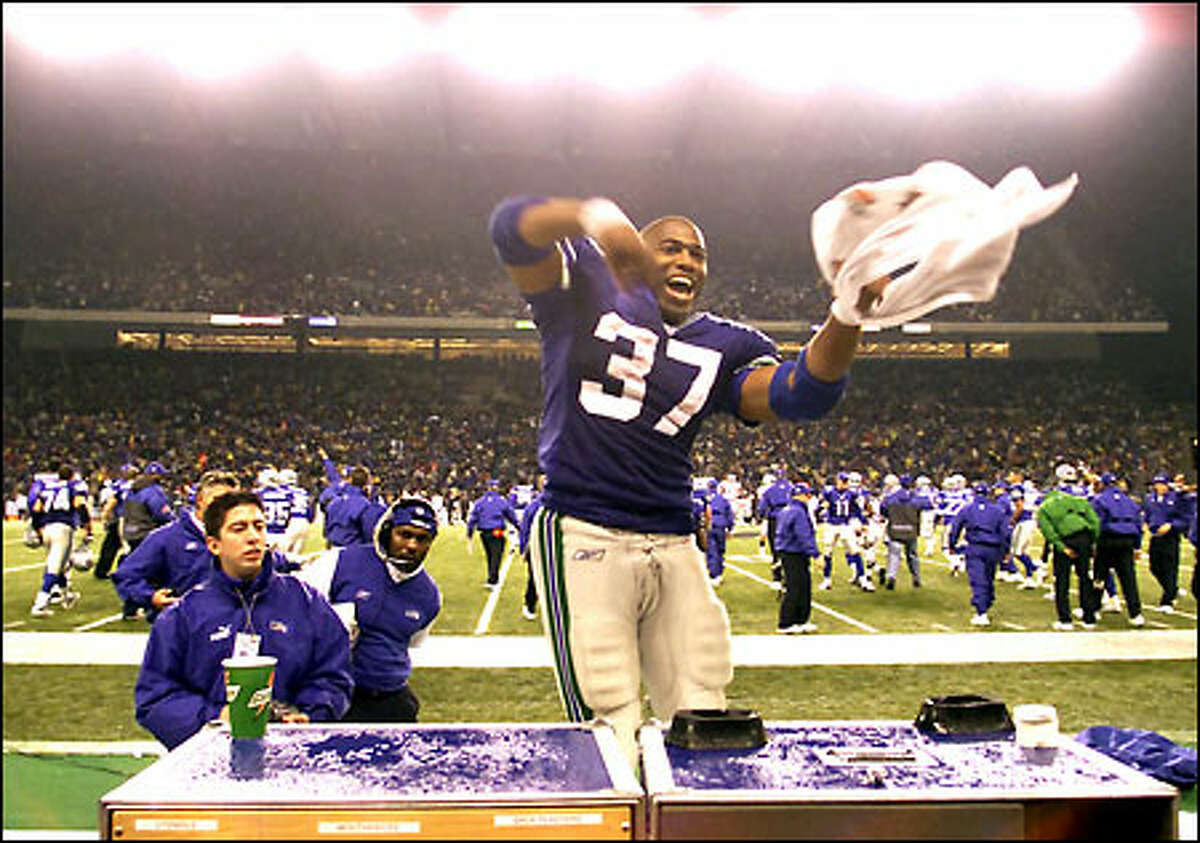 Shaun Alexander rejoices after the Seahawks knocked off the Raiders. The second-year running back shattered franchise records with 266 yards rushing and an 88-yard touchdown run.