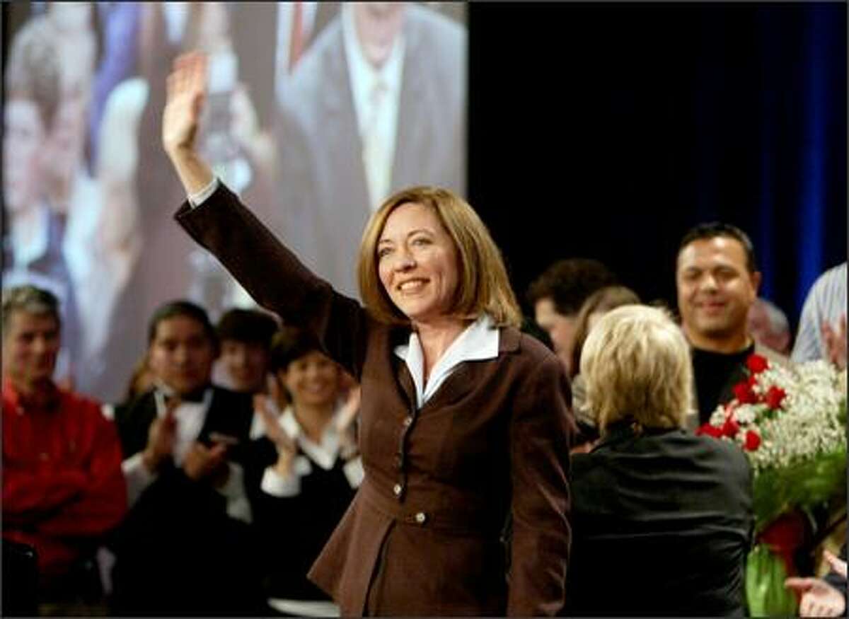 Democratic Sen. Maria Cantwell waves to the crowd after making her acceptance speech at the Sheraton Hotel in downtown Seattle on Tuesday.