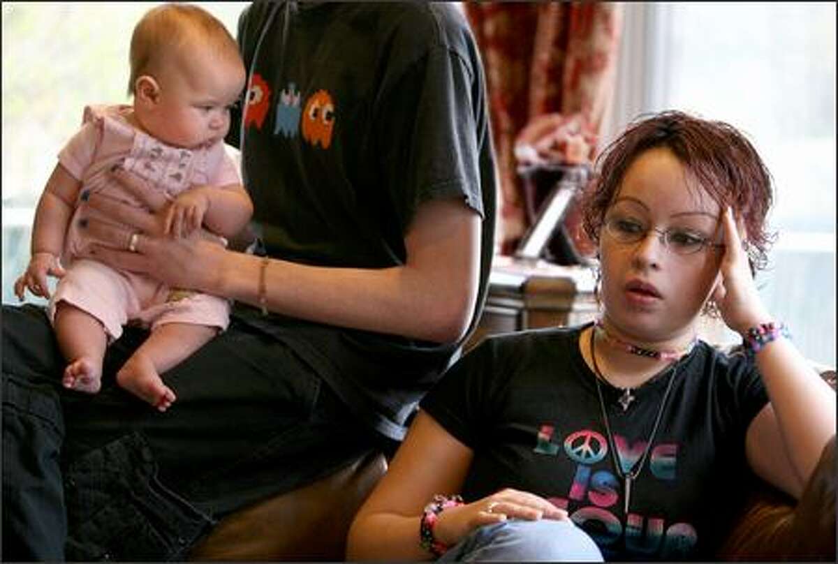 Brittany Guzman-Telford was friend of Justin Schwartz, one of the victims of the Capitol Hill shootings. On the left is her baby Lillie Telford-Guzman, four-months old, being held by Brittany's boyfriend and Lillie's father Jymm Hillman. Brittany found out she was pregnant, coincidentally on March 25, 2006, the day of the shooting.