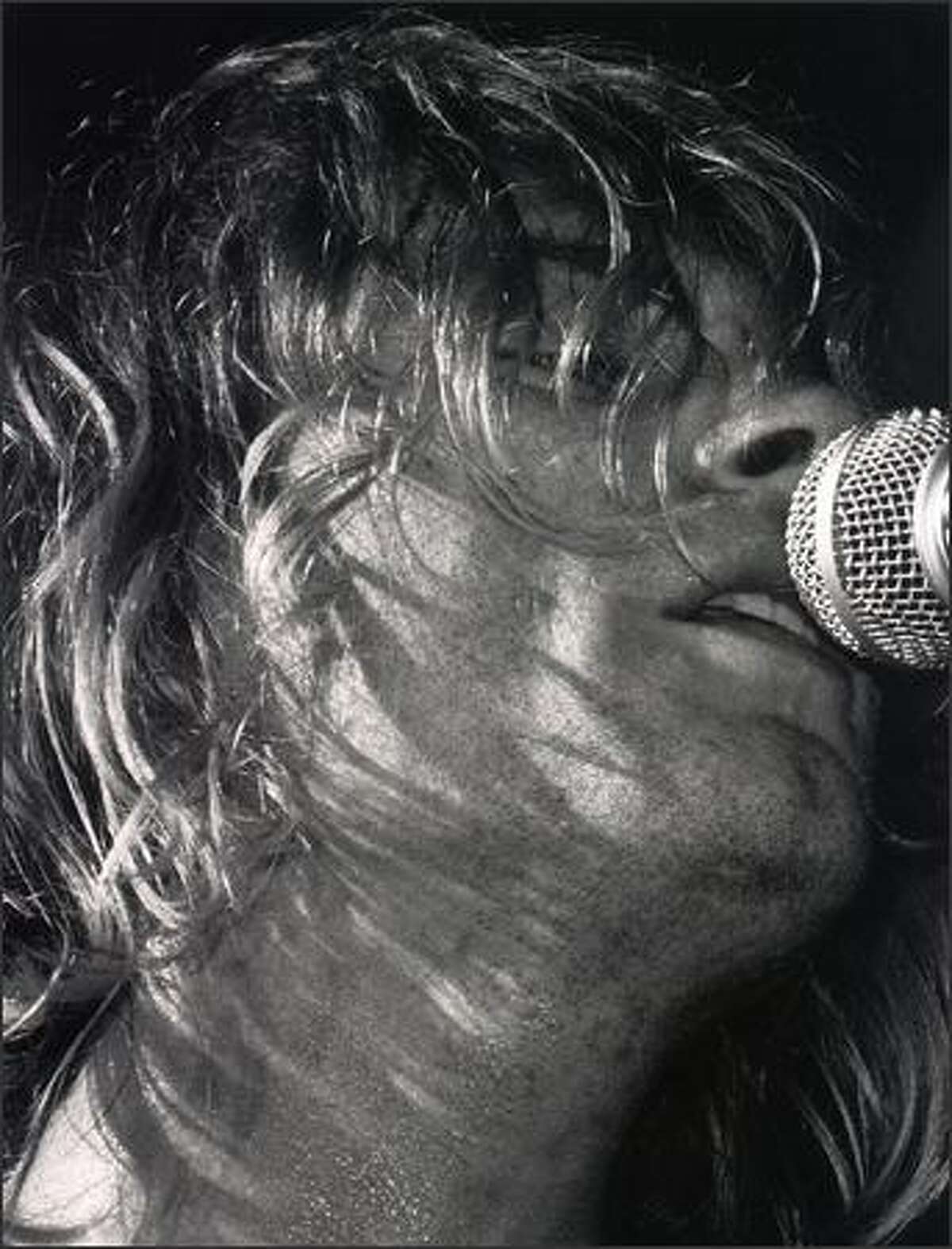 Kurt Cobain sings during Nirvana's concert at the Paramount in Seattle on Halloween 1991.