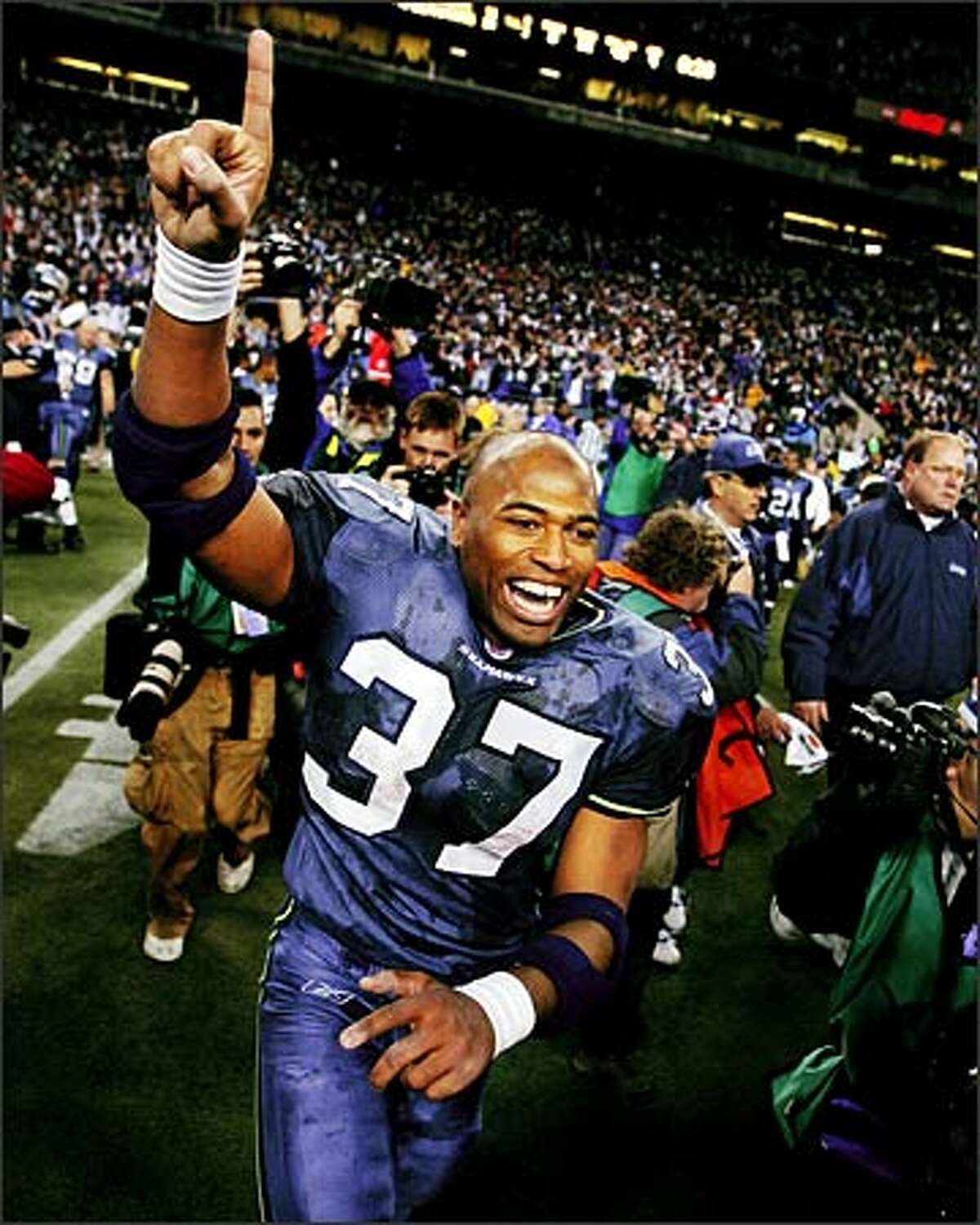 Running back Shaun Alexander runs onto the field to celebrate the Seahawks' NFC Championship victory after time expires.Eklund: One of the high points in Seattle sports history. It was nice to get that moment of exhilaration from the NFL MVP Shaun Alexander. It was a fun day to be at Qwest Field.