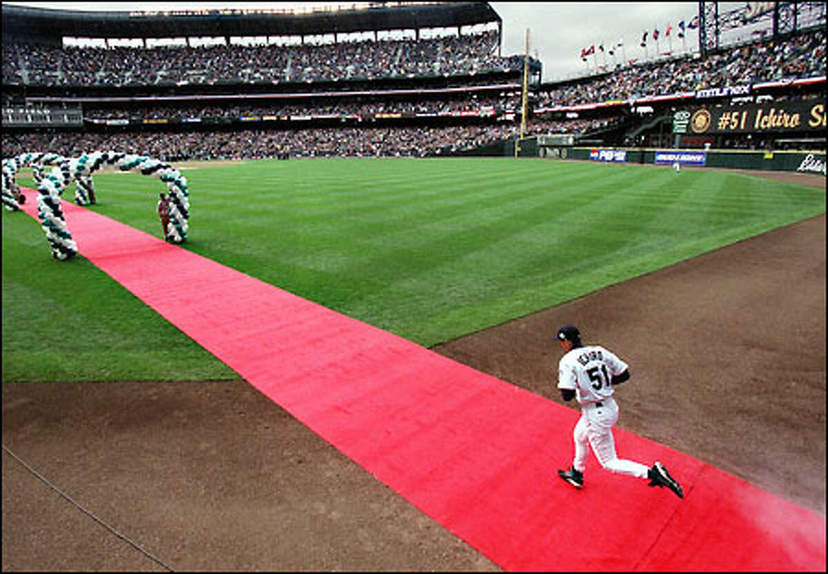 Ichiro takes the field in the Mariners opening game of the 2002 season.