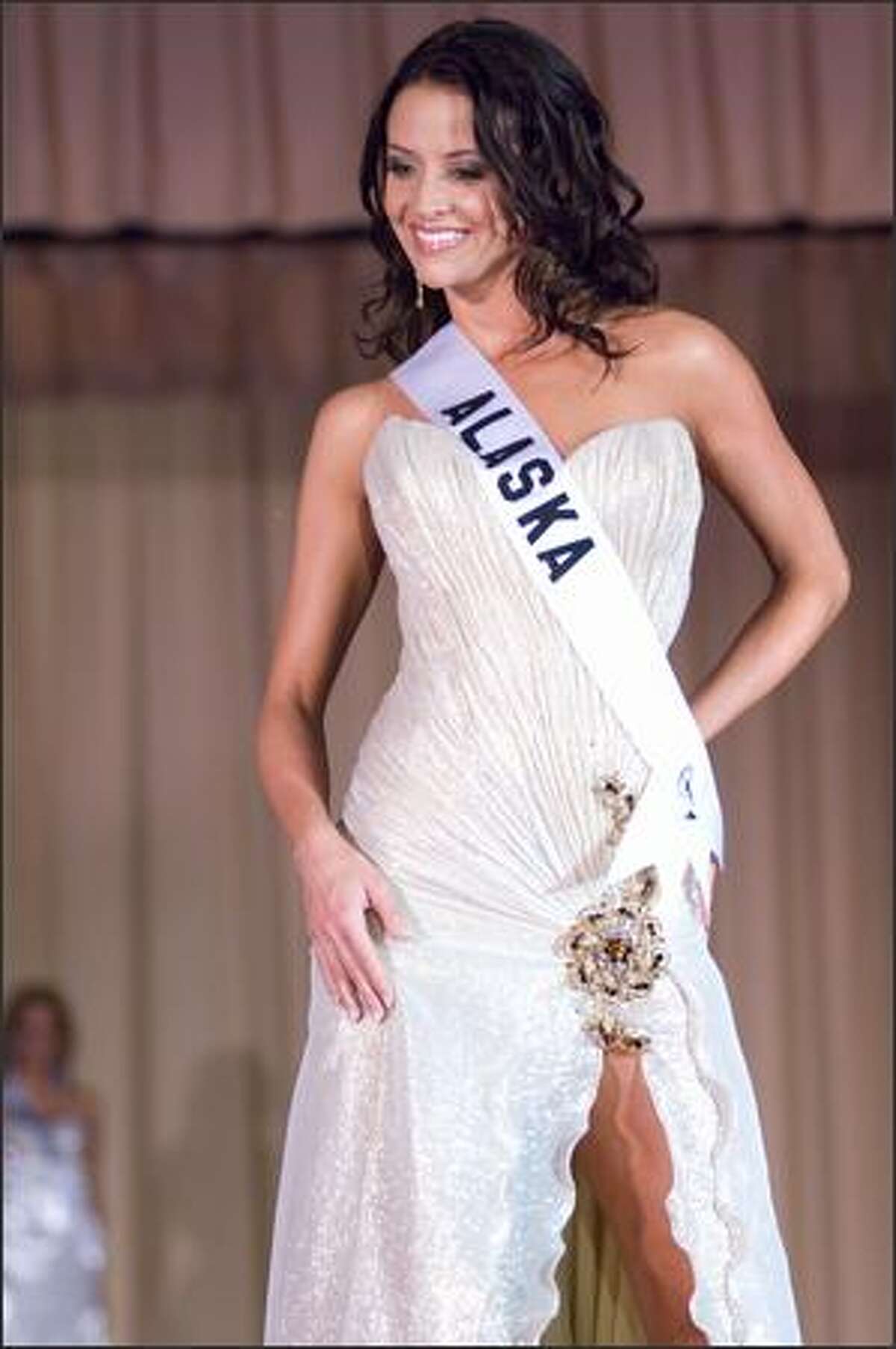 Blair Chenoweth, Miss Alaska USA 2007, competes in an evening gown of her choice during the Miss USA 2007 Preliminary Event at the Wilshire Grand Hotel in Los Angeles on March 19. Each contestant was judged by a panel of judges in individual interview, swimsuit and evening gown categories. The scores will be tallied and the top 15 contestants will be announced during the NBC telecast on March 23.