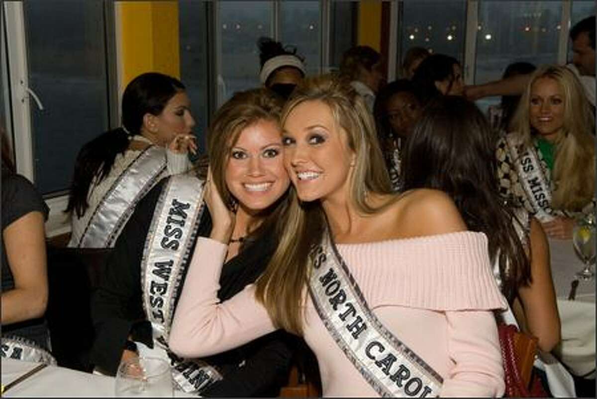Kasey Montgomery, Miss West Virginia USA 2007, and Erin O'Kelley, Miss North Carolina USA 2007, pose for a photo while having dinner at Marisol's on the Santa Monica Pier.