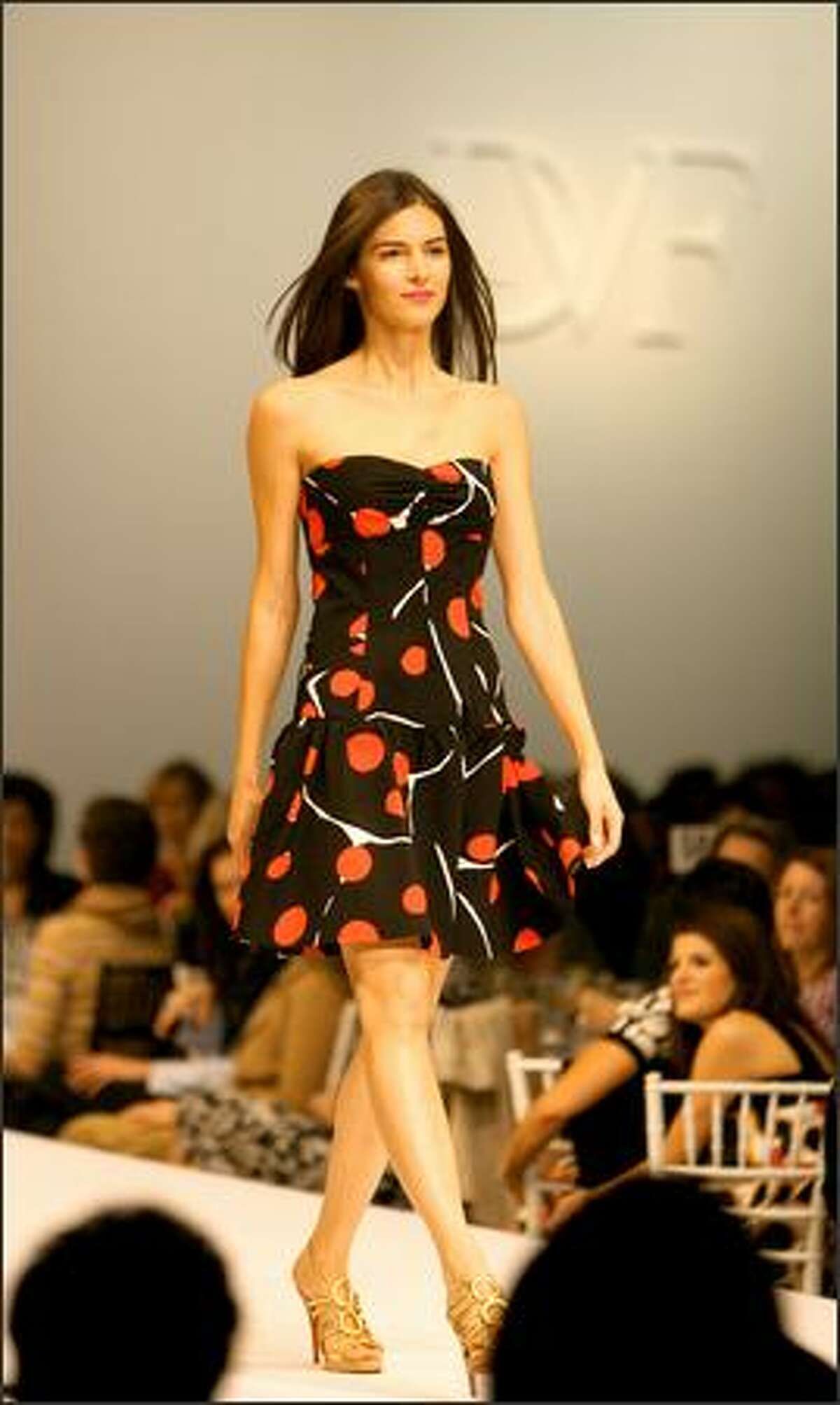 A model displays a ladybug-print "Basilica" strapless dress at the annual Nordstrom Fashion Ovation fashion show to benefit Seattle Repertory Theatre, centering on designs by special guest Diane von Furstenberg.
