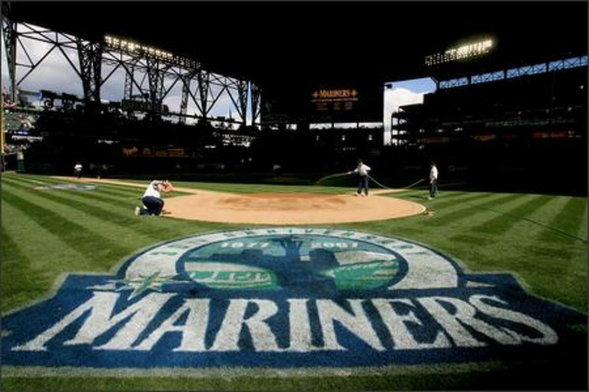 Field preparations during opening day at Safeco Field.