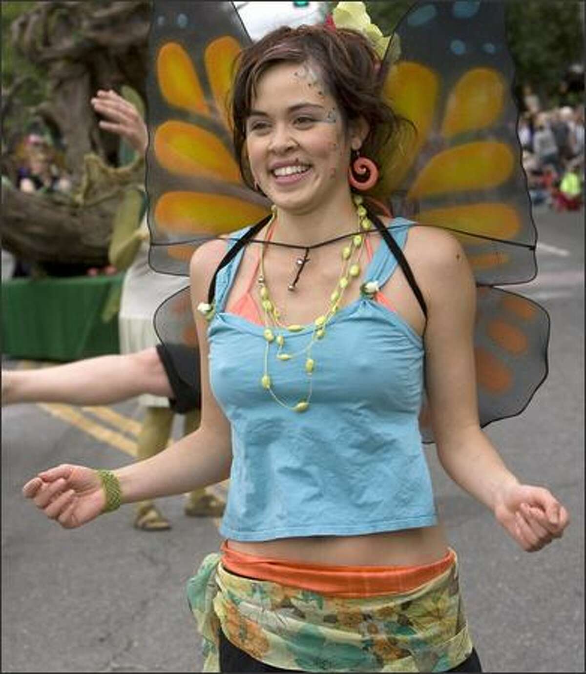 Angie Lemke, dressed as a butterfly, dances in the parade.