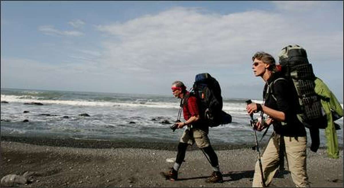 Greg and Lorna Johnston hiking Northern California's Lost Coast Trail. Much of the remote trail is on the beach, making for slow progess. Some of the trail is impassable at high tide.
