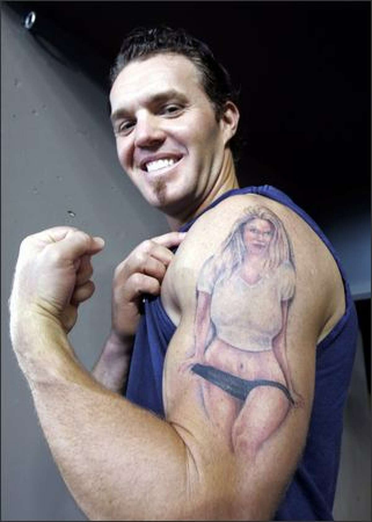 Scott Spiezio shows off his tattoo depicting girlfriend Jenn, 27, a model who lives in Anaheim. The tattoo cost $500 and took about seven hours. (Elaine Thompson/AP/Special to the P-I)