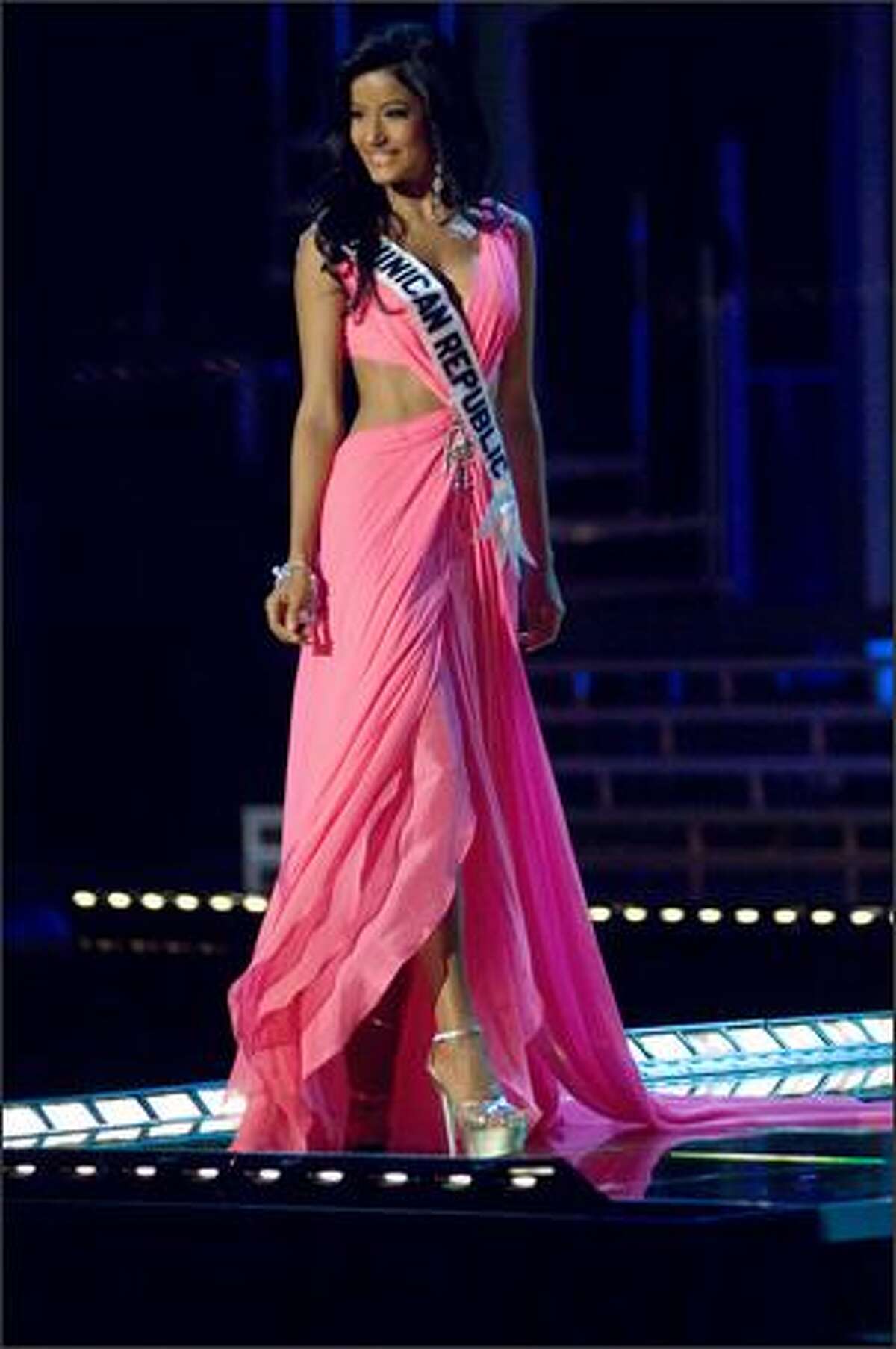 Massiel Taveras, Miss Dominican Republic 2007, competes in an evening gown of her choice during the 2007 Miss Universe Presentation Show at Auditorio Nacional in Mexico City on May 23. During the Presentation Show, each is judged by a preliminary panel of judges in individual interview, swimsuit and evening gown categories. The scores will be tallied and the top 15 contestants will be announced during the broadcast of the finals on May 28 (9 p.m. Pacific, tape-delayed).