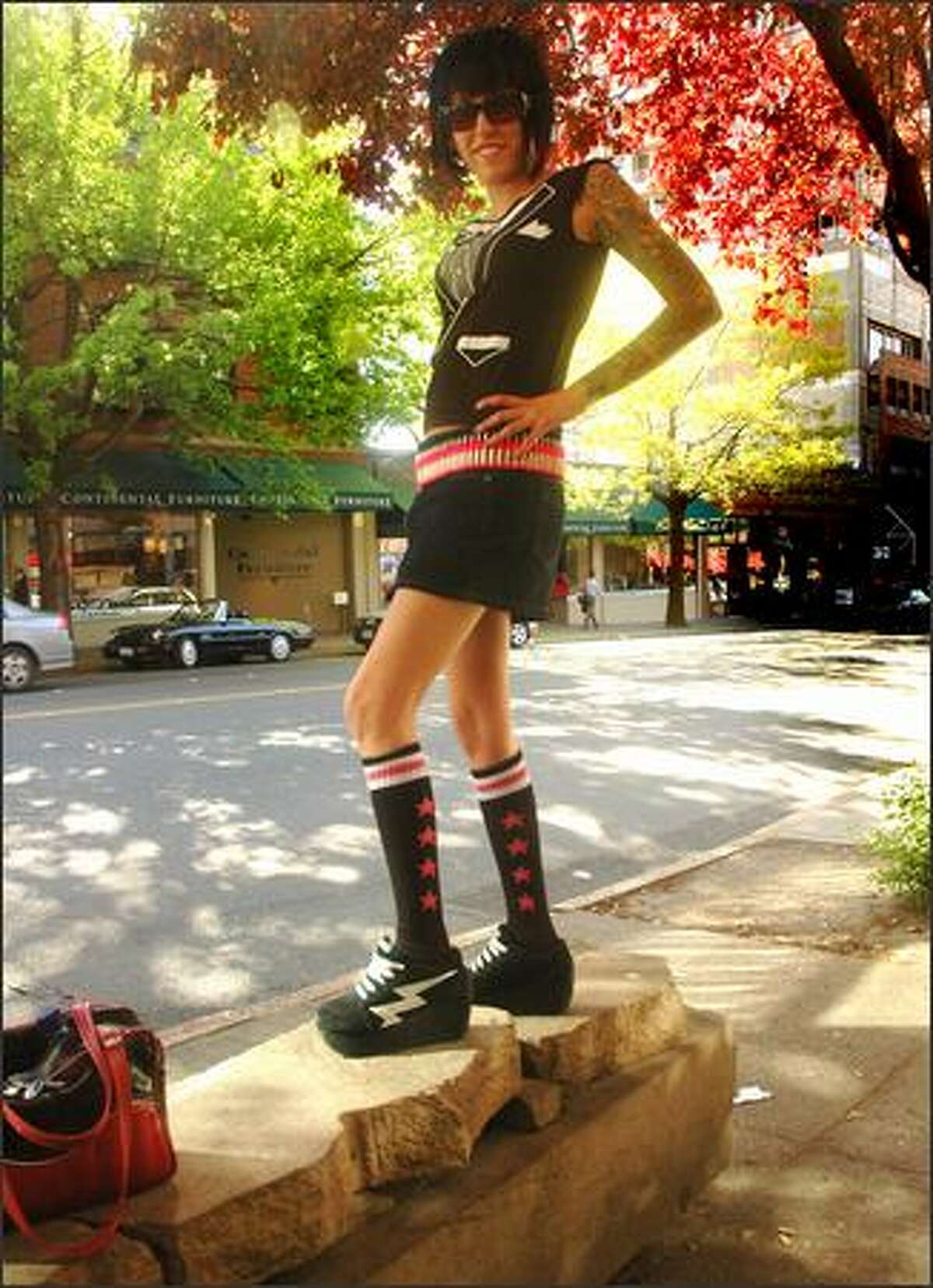 Lauren Goffin poses on a Belltown bench on Monday. Goffin gets most of her clothes in her hometown of Los Angeles but also likes Trendy Wendy on Capitol Hill. She calls her look "rockets' science."