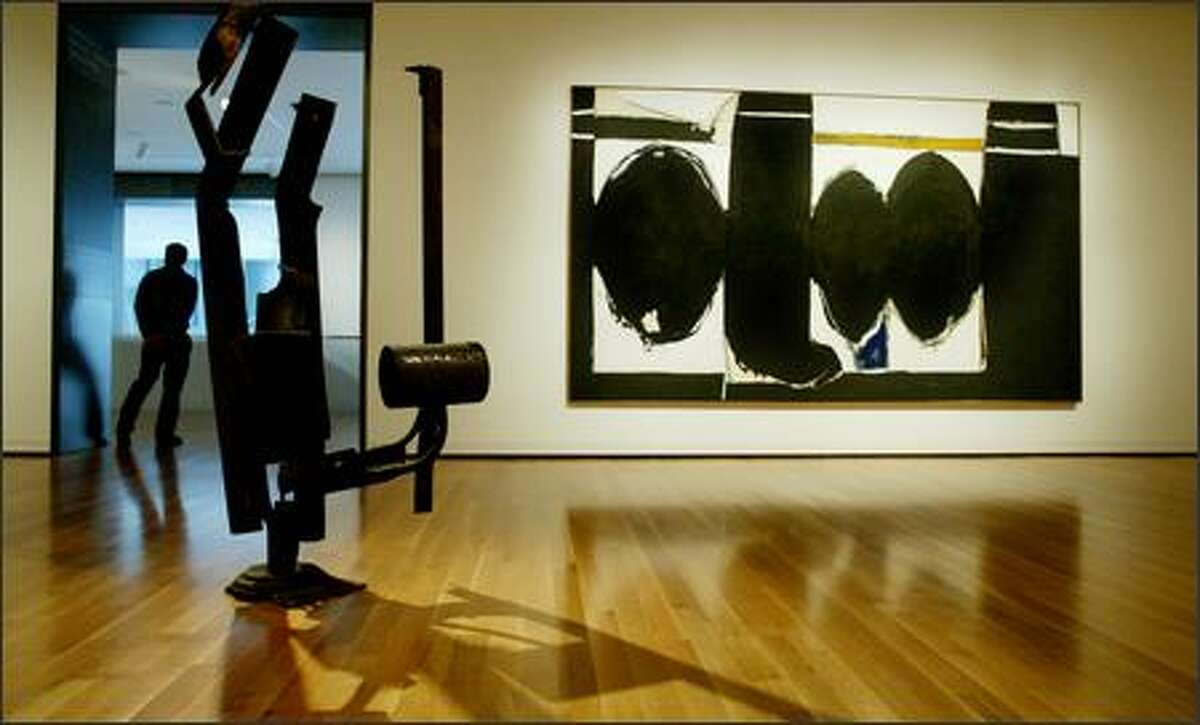 Two pieces from Seattle Art Museum's collection of modern art: Richard Stankiewicz's 1959 sculpture "Big C" and Robert Motherwell's 1971-72 painting "Elegy to the Spanish Republic #124."