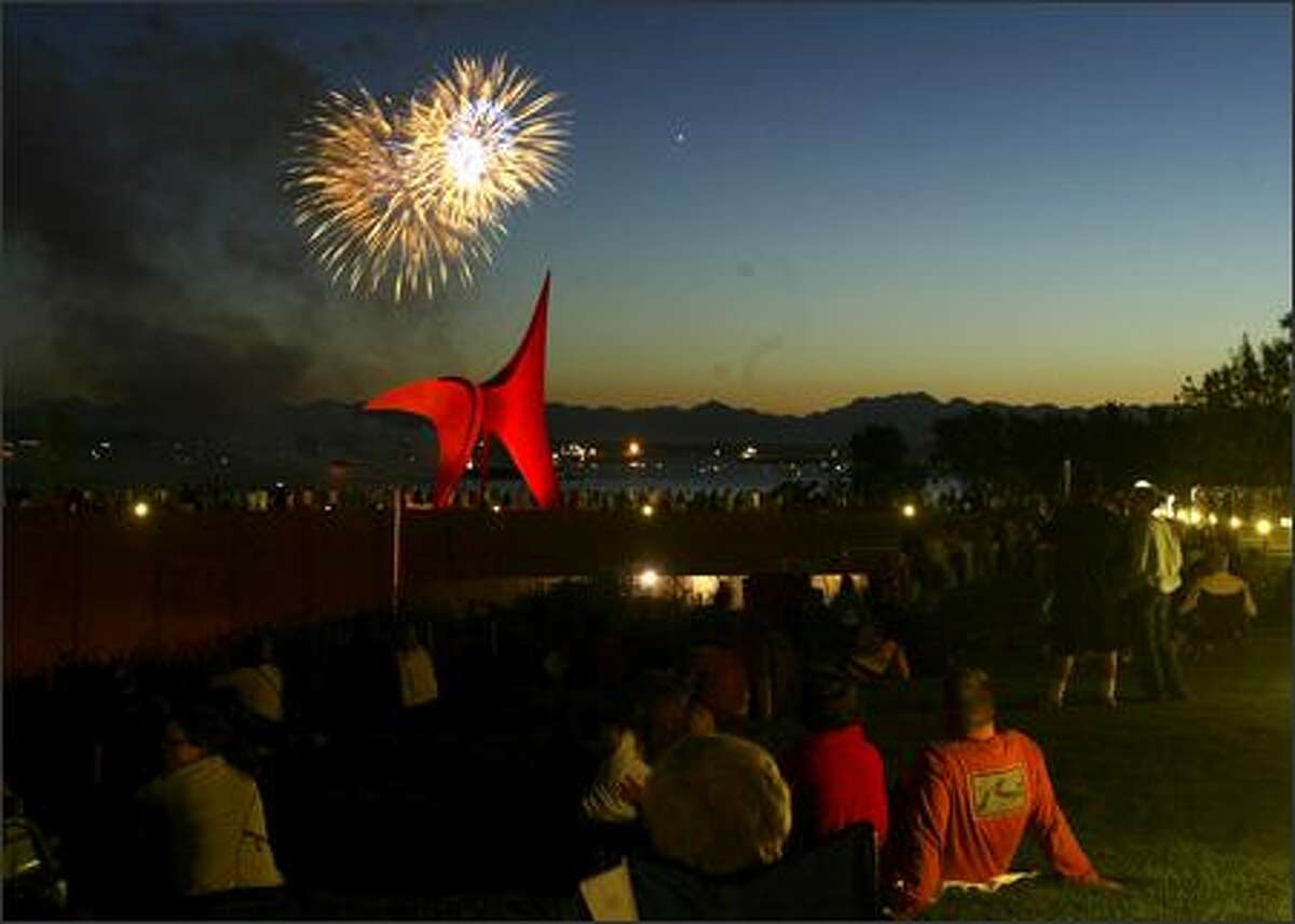 People were able to watch the 34th annual Fourth of Jul-Ivar's fireworks display for the first time from the Olympic Sculpture Park. In the foreground is Alexander Calder's sculpture "Eagle" (1971).