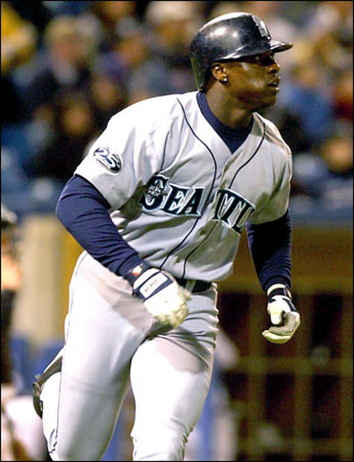 Seattle Mariners' Mike Cameron rounds the bases on his fourth home run of the game, in the fifth inning against the Chicago White Sox on Thursday, May 2, 2002, in Chicago. Cameron became only the 13th player in major league history to homer four times in a game. Seattle won 15-4.
